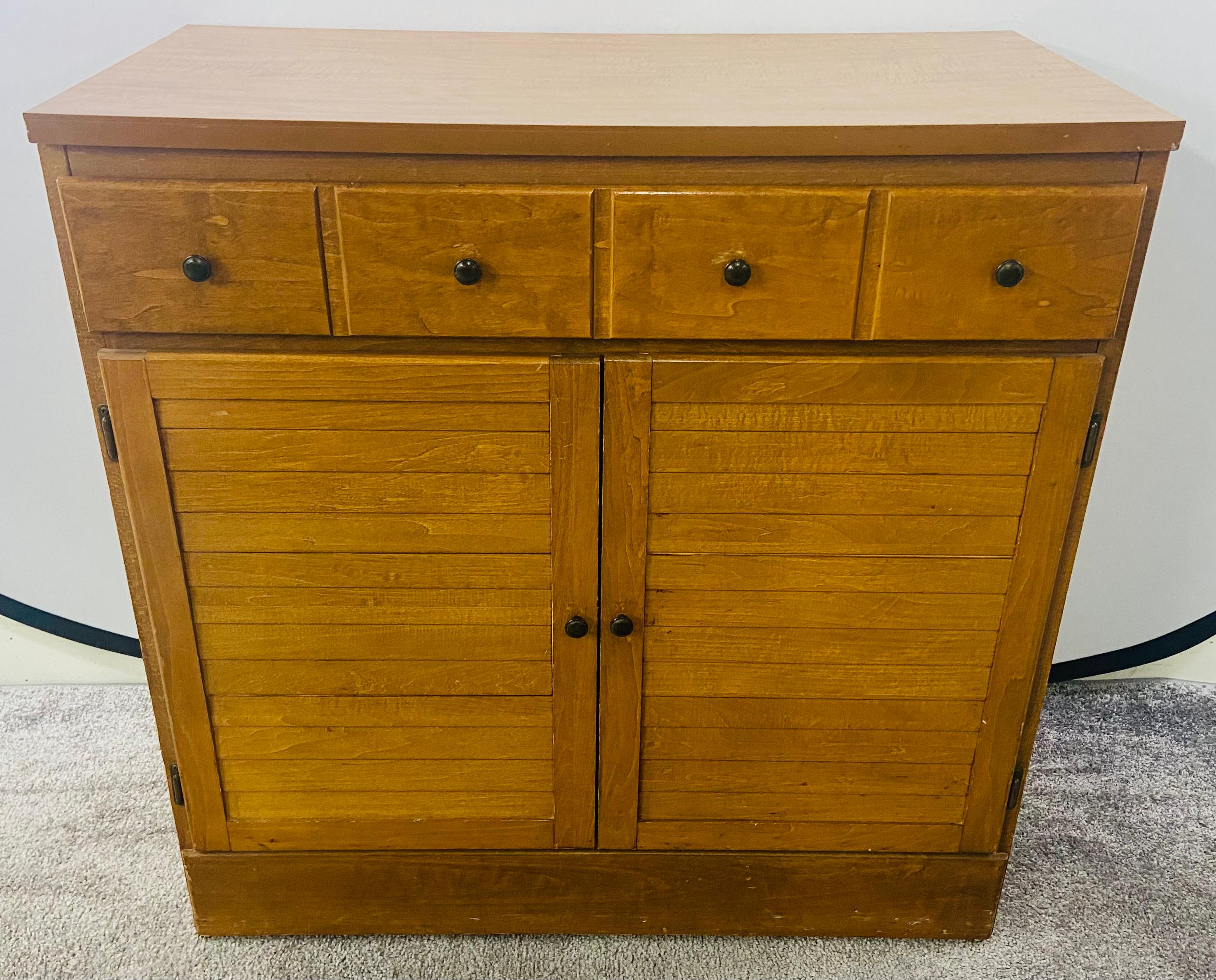 A charming and elegant Mid-Century Modern nightstand, chest or cabinet. The MCM chest features a one large drawer over two door cabinet opening to reveal one shelf for additional storage room. The drawer has four nobs to look as four drawers. All