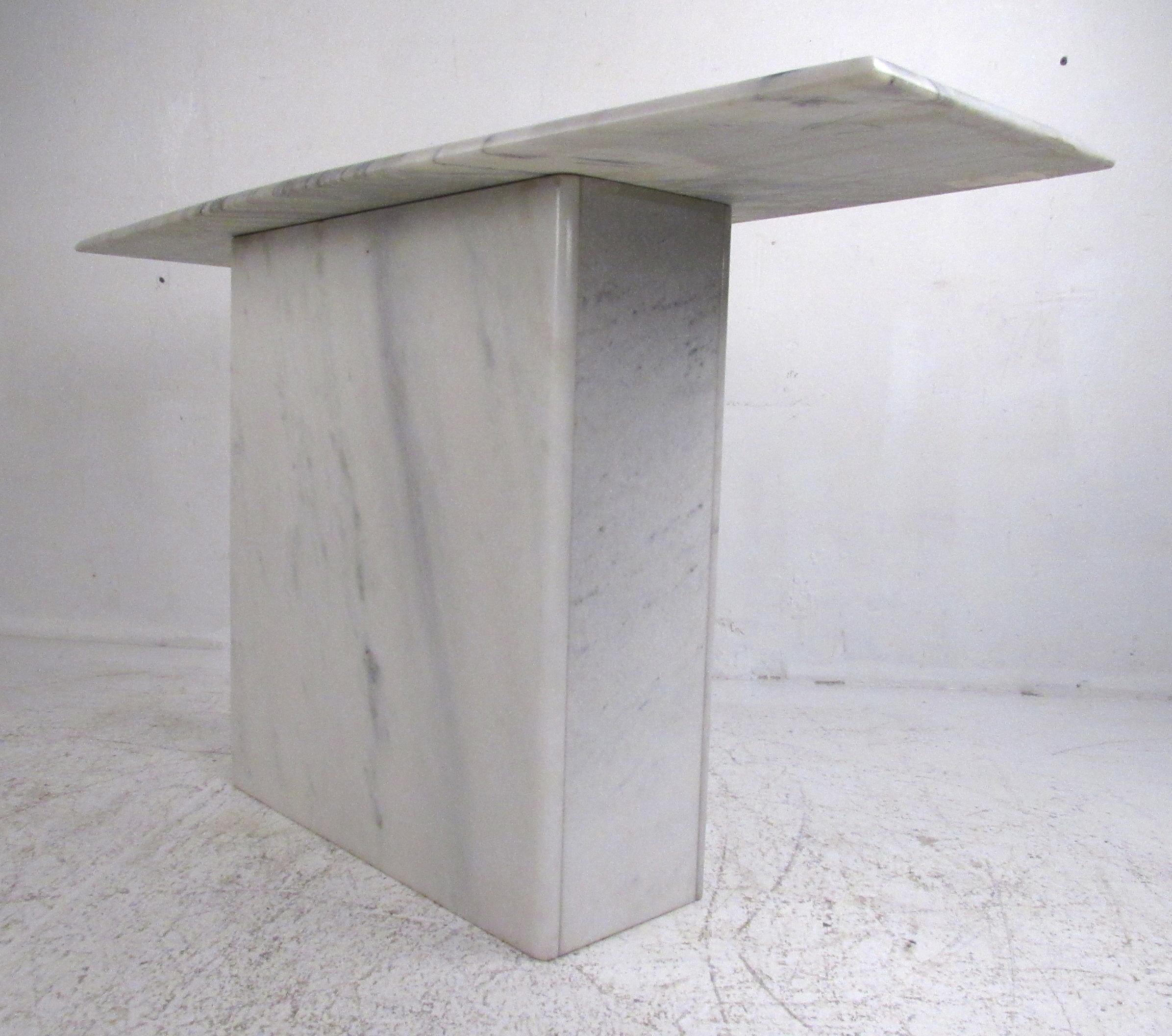 Simple, understated but elegant pedestal console table in white and grey marble.
Please confirm item location (NY or NJ) with dealer.