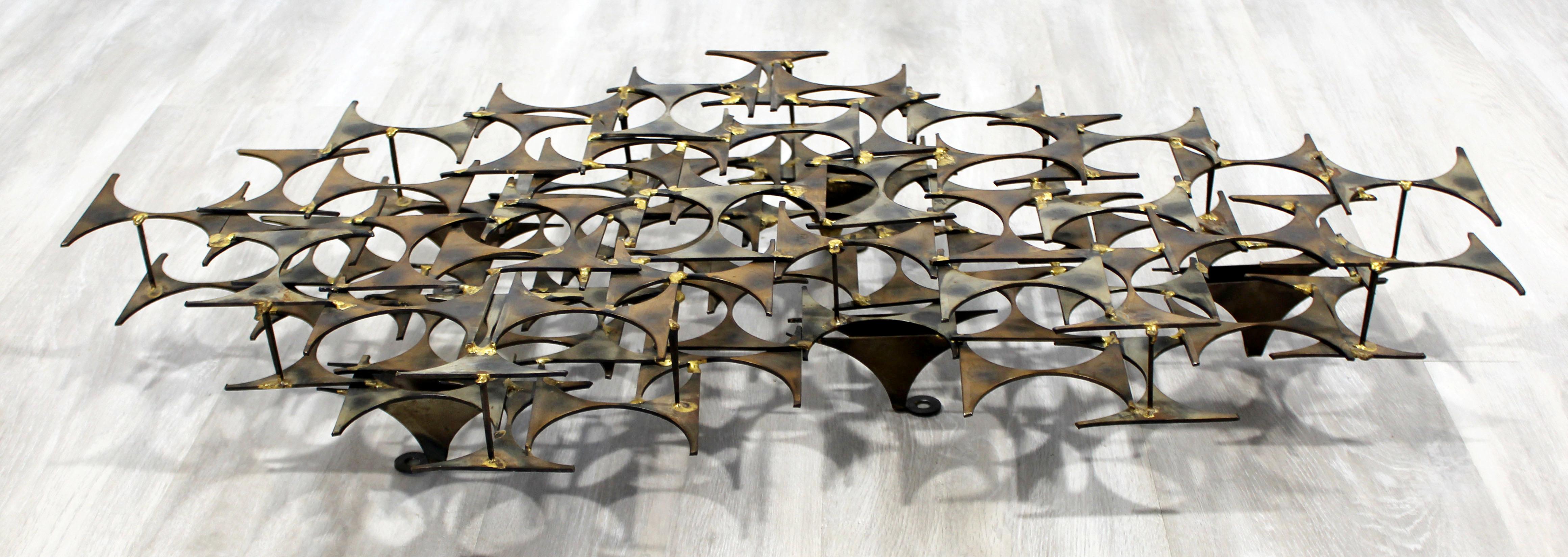 For your consideration is a beautiful, brutalist, metal and brass, wall sculpture by Marc Weinstein creates, in one of his Classic designs, circa the 1970s. In excellent condition. The dimensions are 34