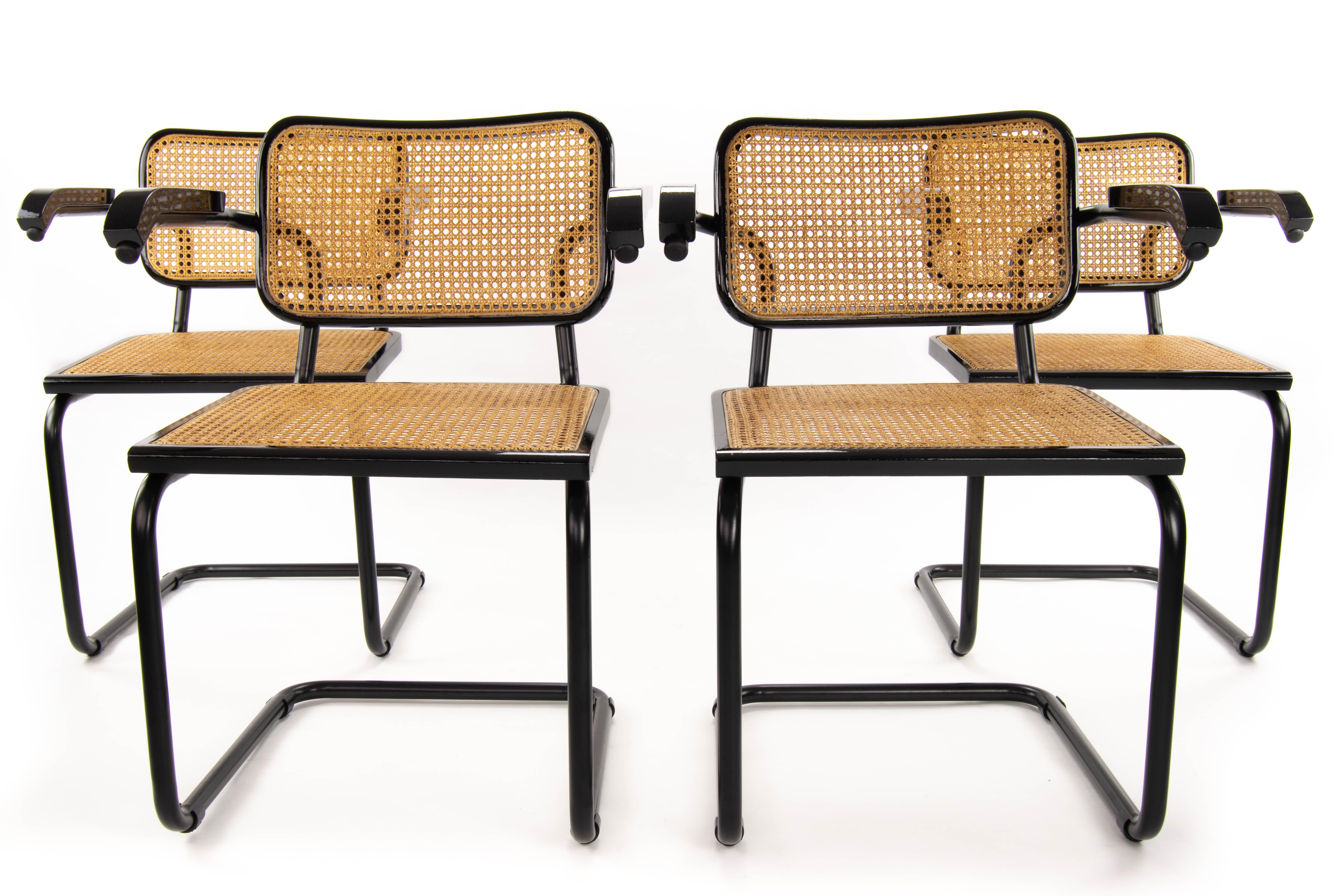 Set of four Cesca chairs, model B64. Tubular structure in black lacquered steel in excellent condition. Beech wood frames lacquered in black and Viennese natural grid. Grids of the four seats and backs have been put new.
Measures:
Total height