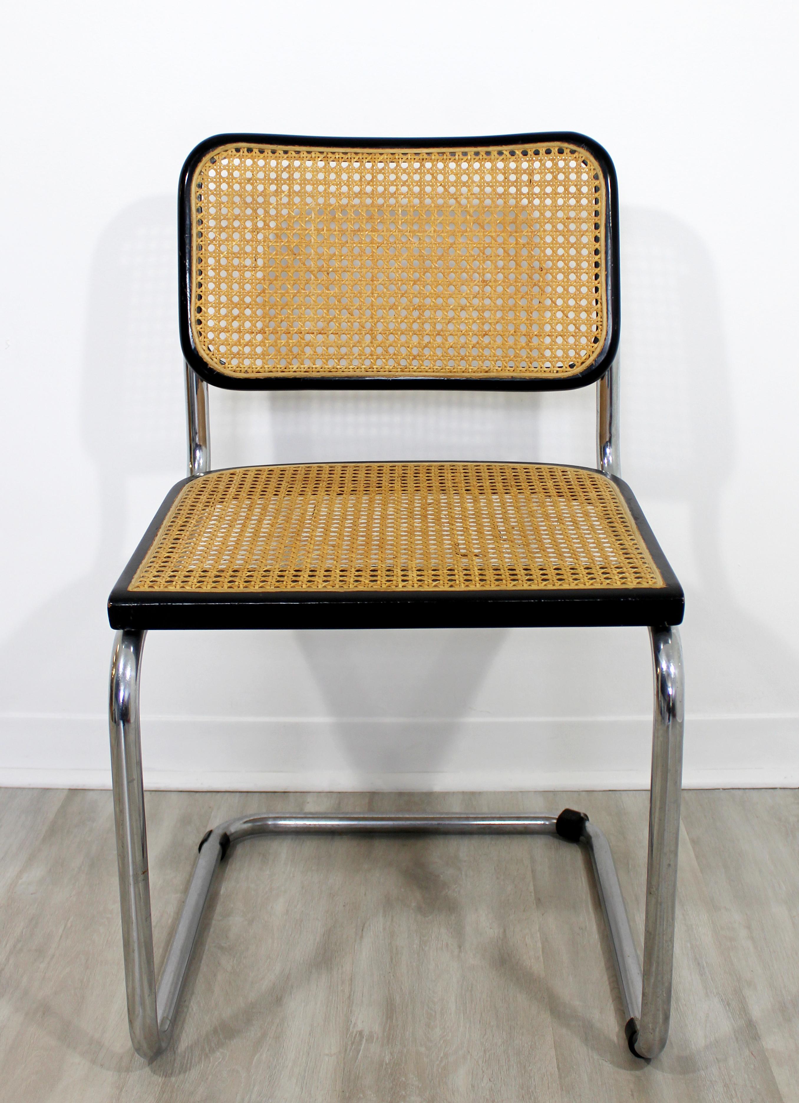 For your consideration is an incredible side chair, made of cantilvered chrome, cane and black lacquered wood, by Marcel Breuer, circa 1960s. In excellent vintage condition. The dimensions are 18