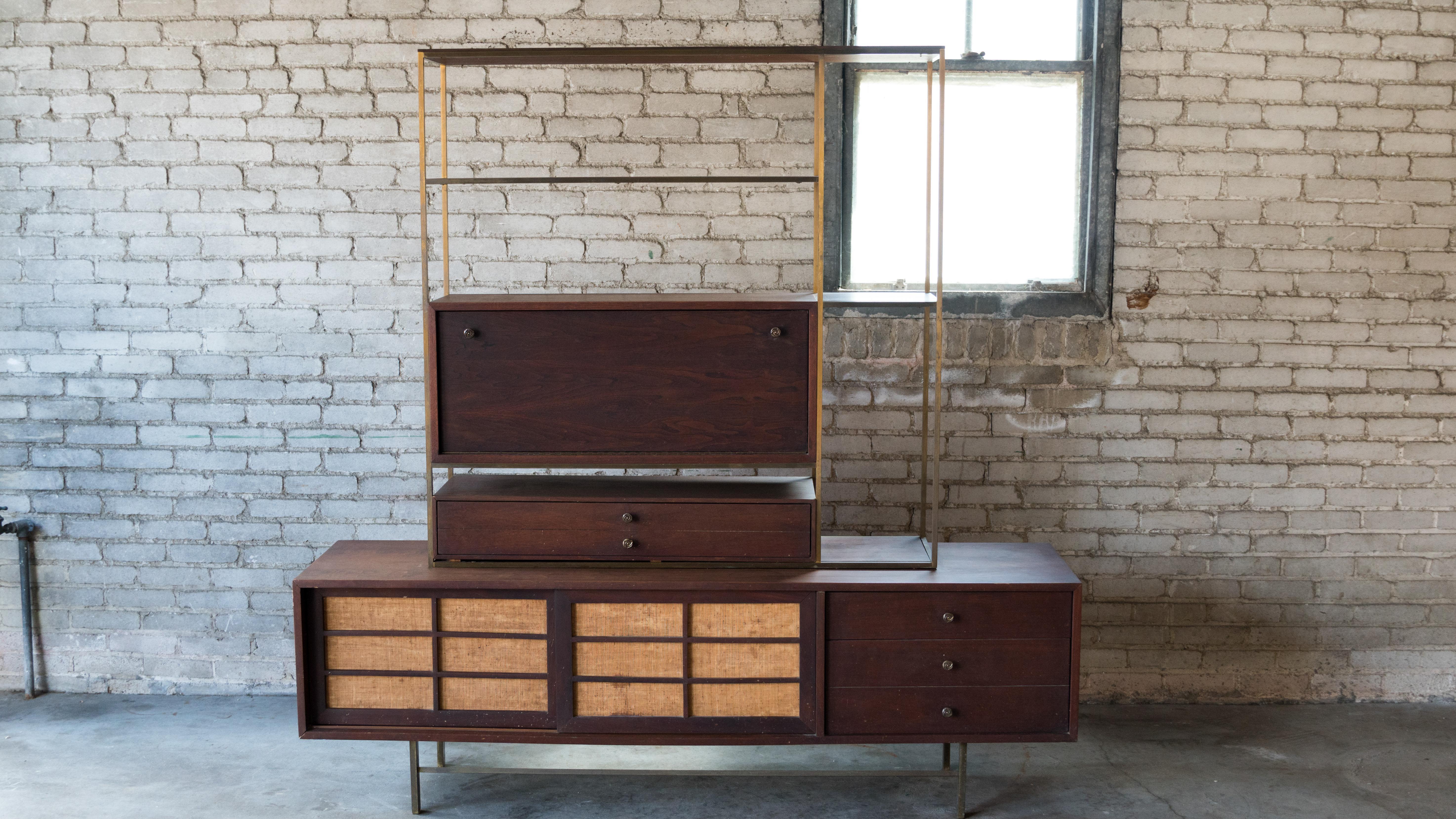 Rare and iconic Furst and Fellner for Furnette modular wall unit credenza, circa 1950s. Features walnut and brass construction and features a fold out desk surface, three drawers and ample storage space. Age appropriate wear. Versatile piece with