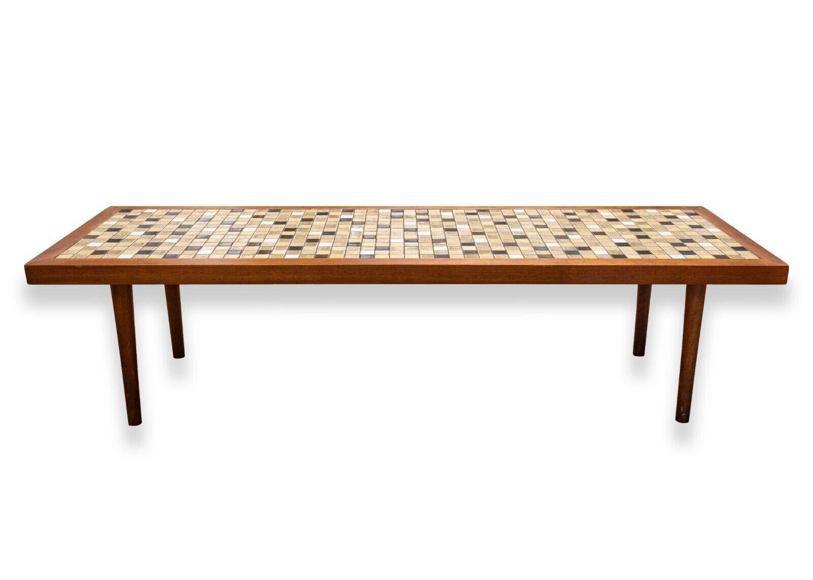 A mid century modern Marshal Studios Martz tile Wood rectangular coffee table. An understated and stunning coffee table designed by Gordon and Jane Martz for Marshall Studios. This beautiful piece features a walnut wood construction with a checkered