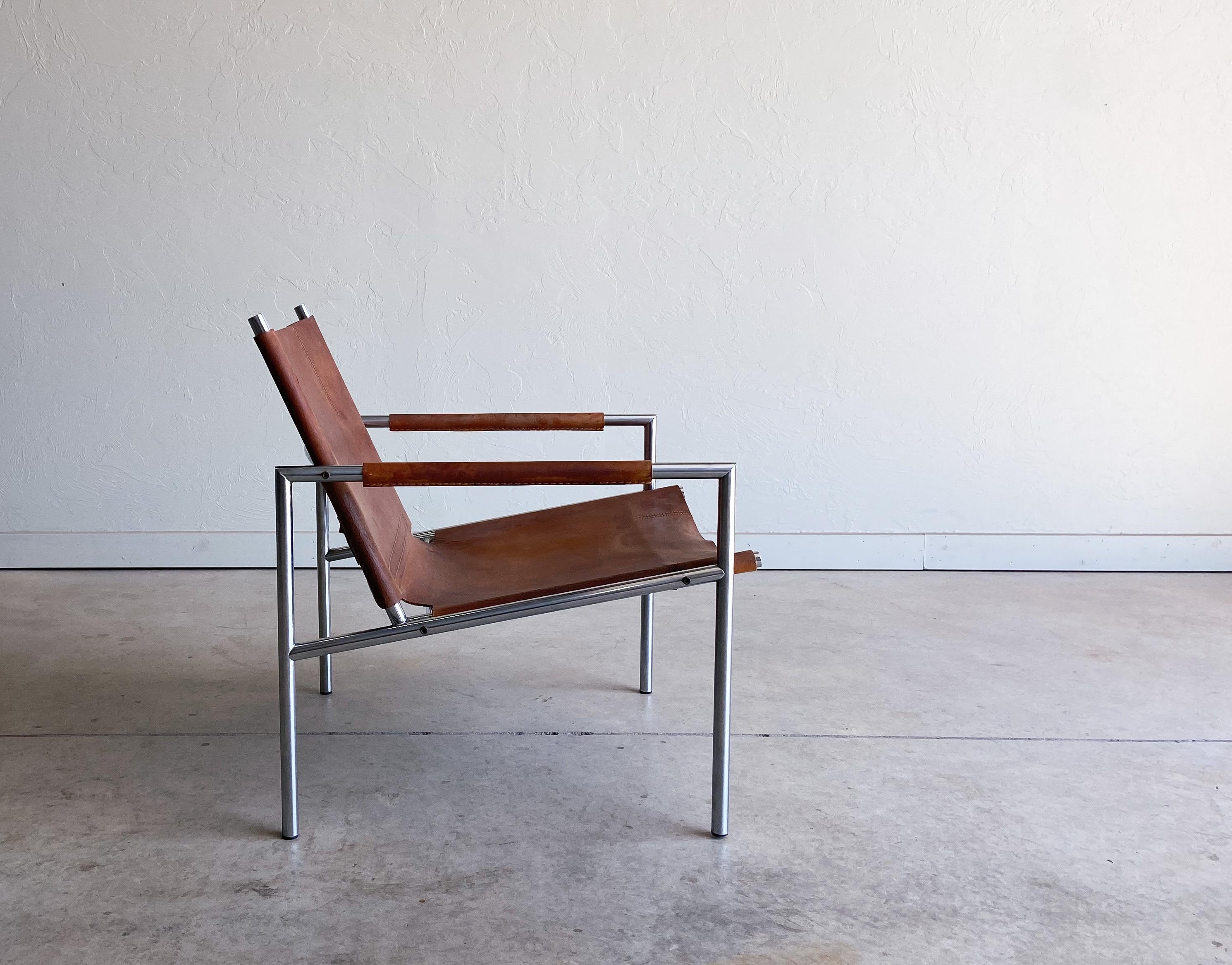A beautiful lounge chair designed by Martin Visser, model SZ02. Featuring a thick, one piece saddle leather seat supported by a chromed steel frame. Ergonomic and comfortable. An overall wonderful chair with a great stance and appearance.

The