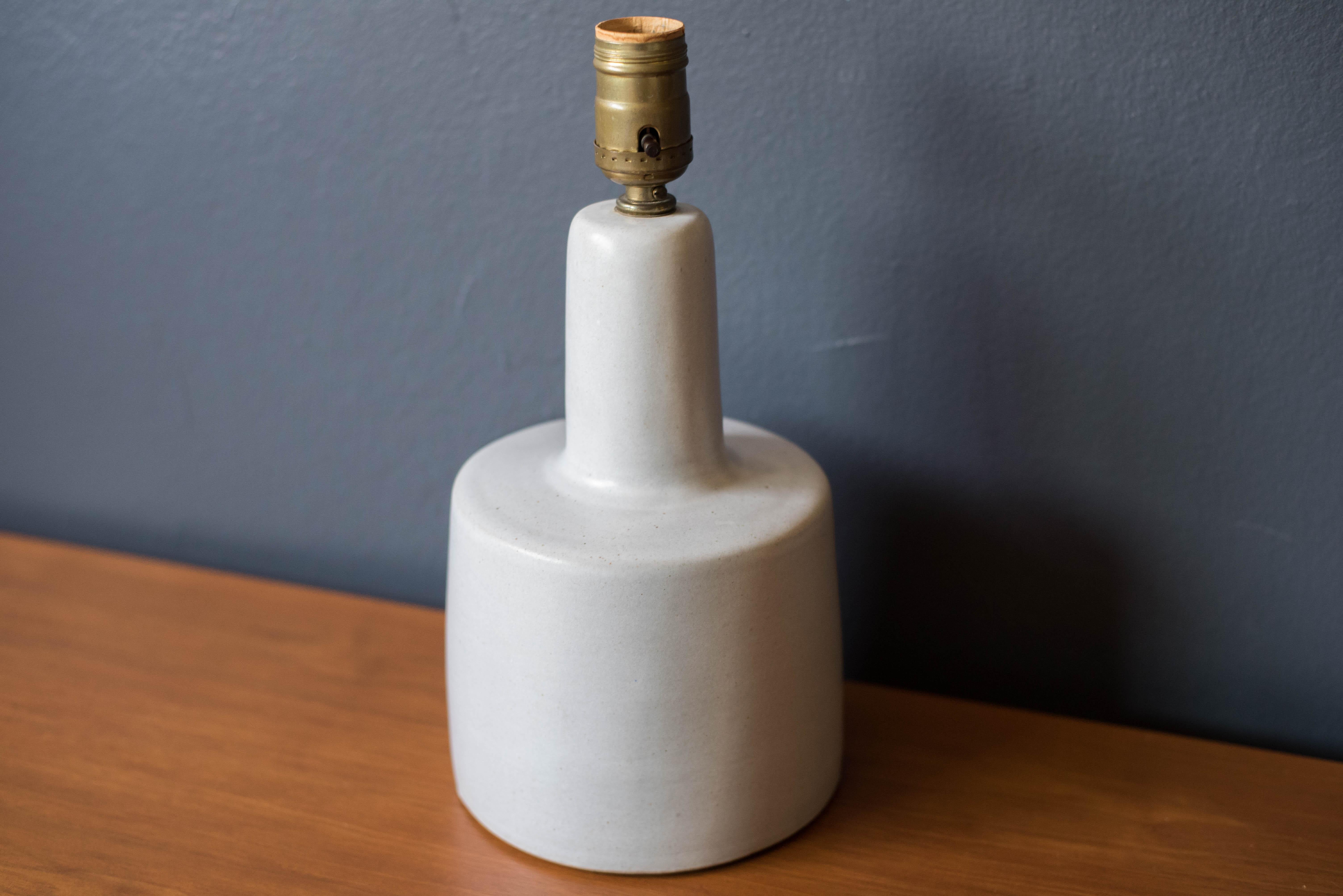 Mid Century stoneware pottery lamp by Jane and Gordon Martz for Marshall Studios. This piece displays an off white or light grey matte finish.