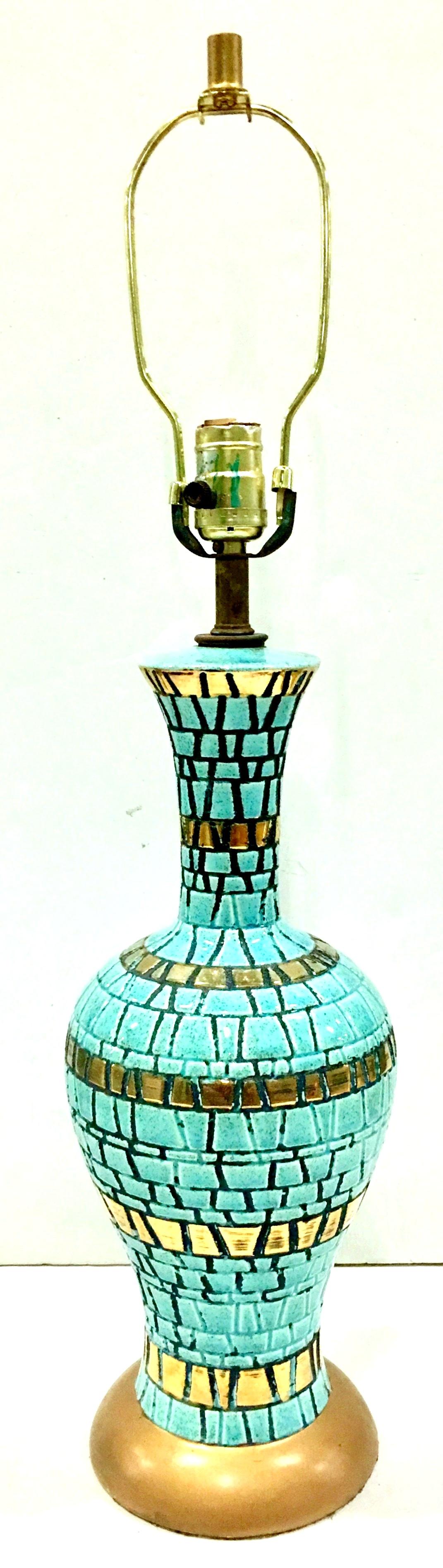 1950'S, Mid-Century Modern Martz style turquoise and metallic gold with black accent ceramic mosaic tile table lamp. Gold metallic painted brass base. Includes brass finial and harp. Wired for the US and in working order.
Measures: Height to socket,