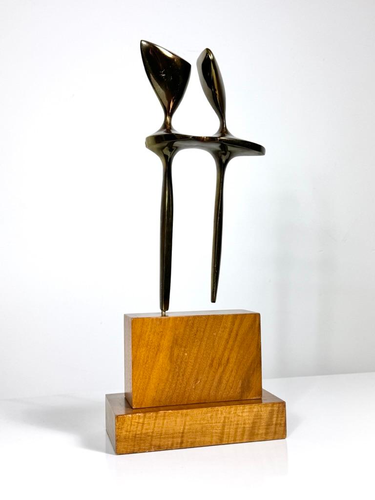 Modernist bronze sculpture by St. Louis artist Mary Bolte circa 1950s
Abstract depiction of two figures in lacquered solid bronze mounted to a wood base
Signed and numbered 18/100

8 inch width
4.5 inch depth
19.25 inch height