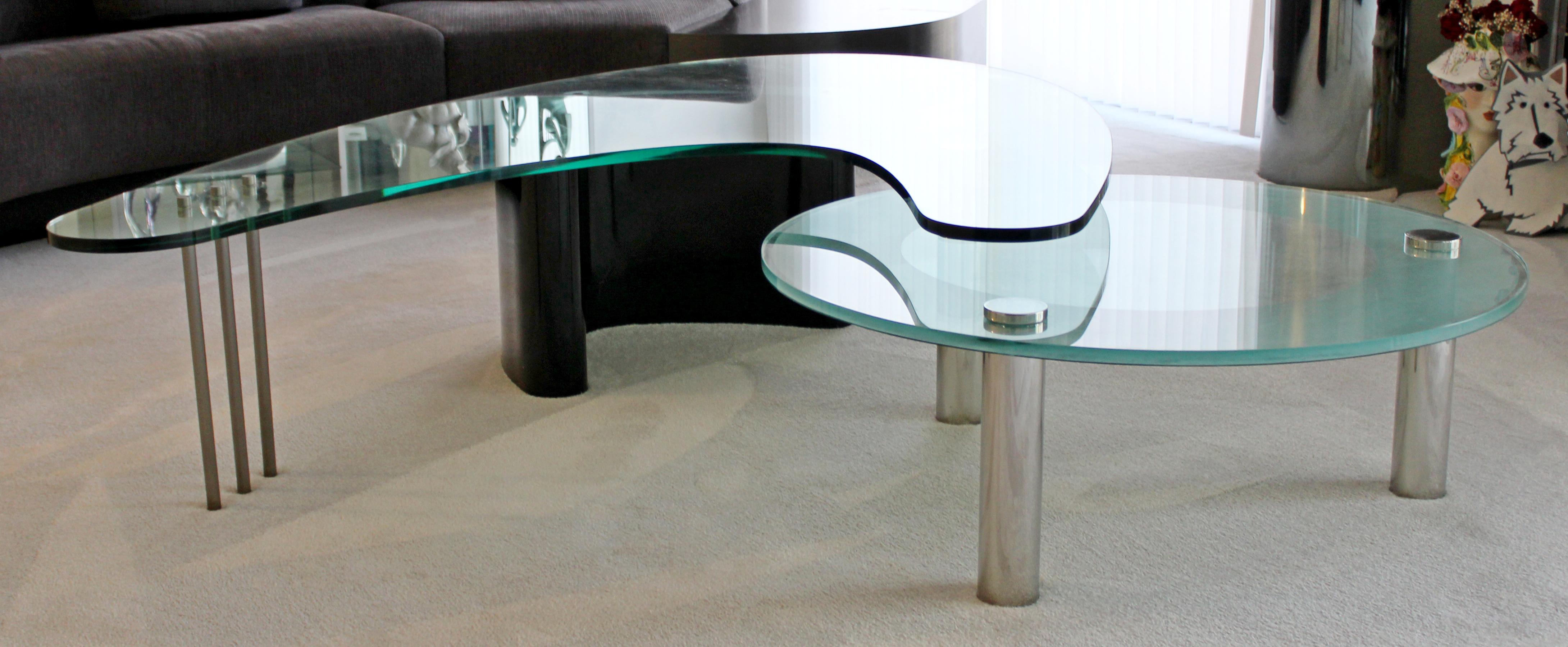 For your consideration is a totally unique, custom made coffee table, with mixed chrome and black bases and with asymmetrical glass tops, circa the 1970s. In excellent condition. The dimensions are 77