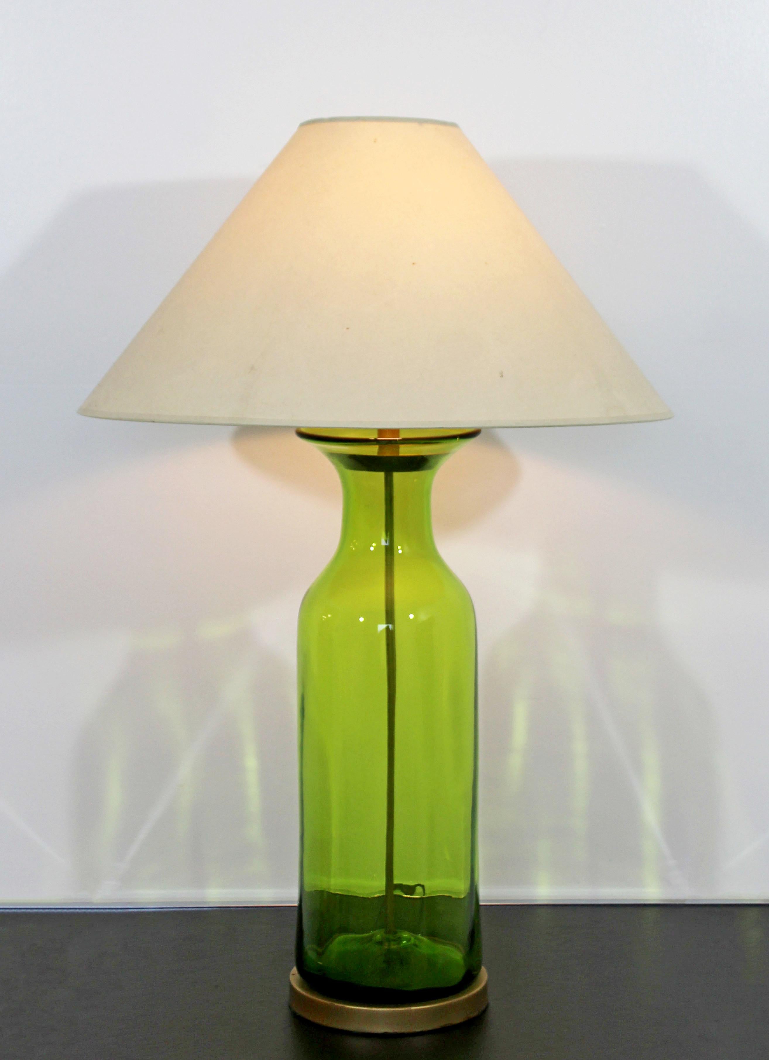 For your consideration is a magnificent, massive table lamp, made of hand blown, green Blenko Glass and brass, circa 1950s. In excellent condition. The dimensions of the lamp are 7