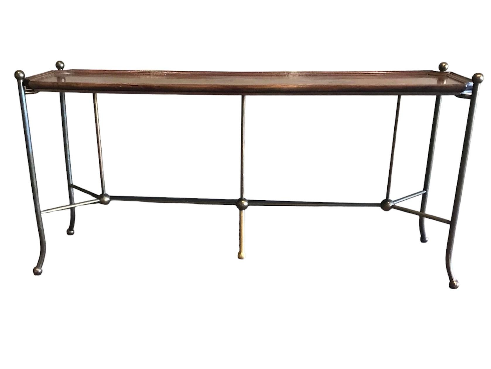 Exceptional Mid Century Modern Mastercraft Burl Wood and Brass Console with a thin footprint.  With an ogee frame design, the burl is dark walnut and the corners have a C shape allowing the Brass supports topped with a ball design, to rise above the