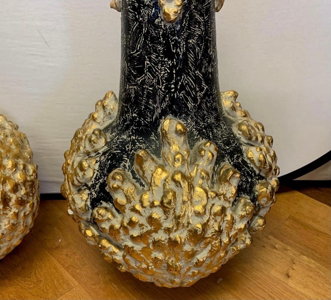 Rare and unusual set of Brutalist ghourd sculptures. Use them as sculptures of make lamps out of them.
Either way, you win! Handpainted and truly one of a kind. Made of plaster and handpainted in black and gold.