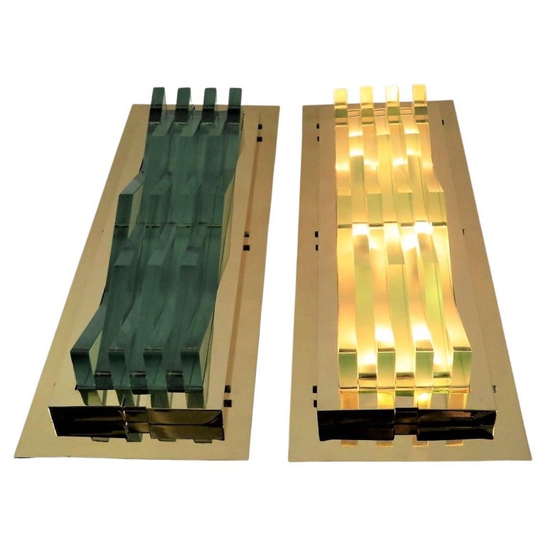 Exceptional Pair of Brass and Thick Glass Wall Lights, Appliques or Sconces by the master designer Max Ingrand for Fontana Arte. Large and perfect for a restaurant, bar or expansive house. Truly exceptional and quite impressive. 
The thick glass in