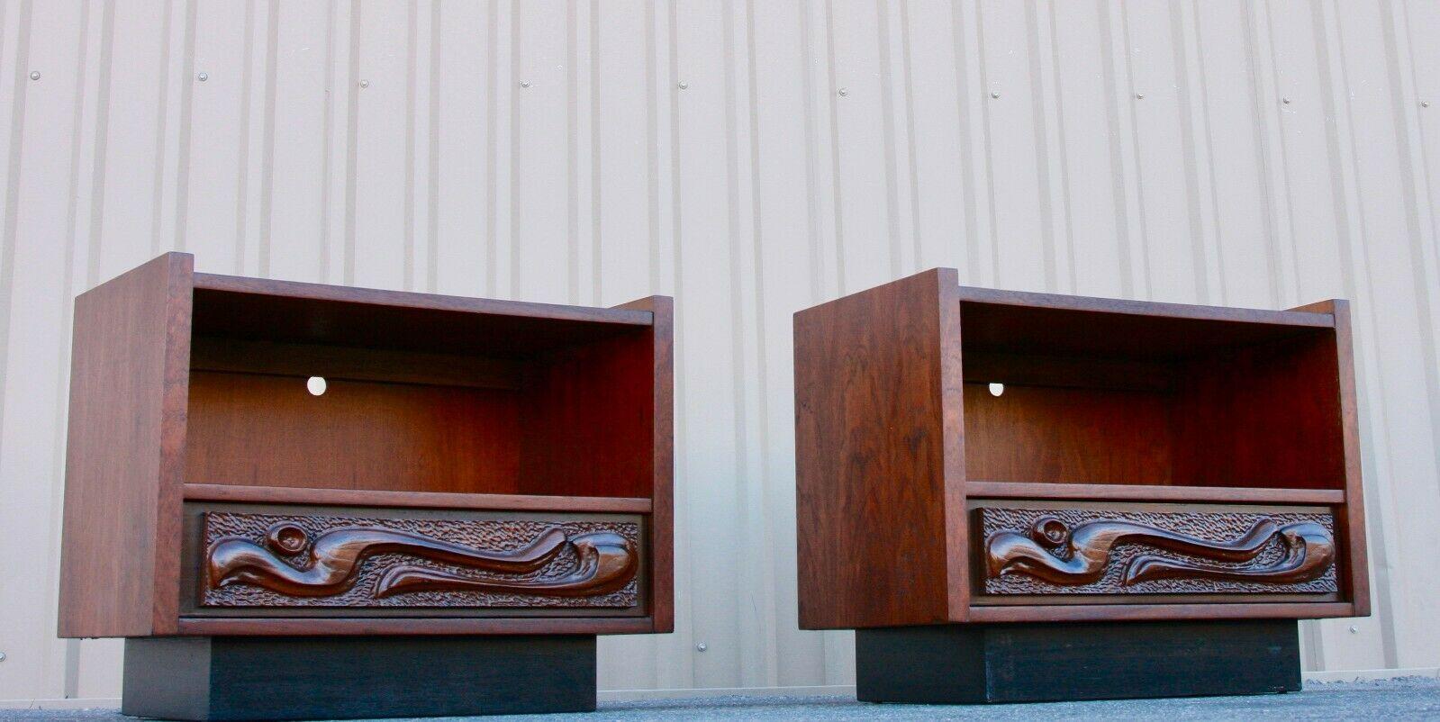 Pair of Mid-Century Modern oceanic sculpted walnut nightstands by Pulaski Furniture Co

This fantastic lacquered sculpted walnut 'Oceanic' pair of nightstands are by Pulaski Furniture Corporation, circa 60’/70’swhich perfectly encapsulates the