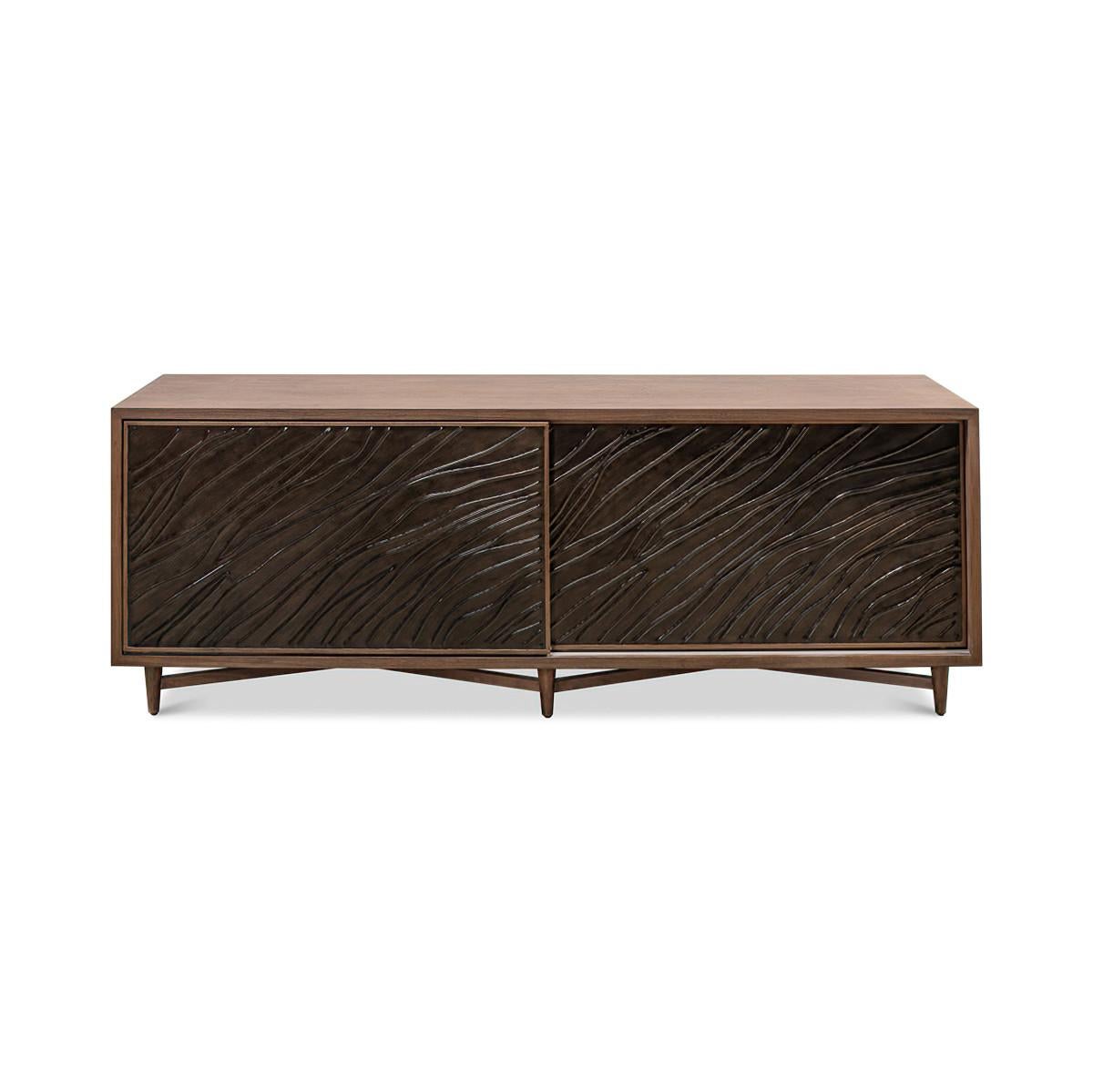 Mid-Century Modern Media storage cabinet, with two metal sliding doors, a knotty walnut frame in a brown transitional finish, the interior with one drawer and adjustable shelf, raised on round tapered legs with a stretcher.

Dimensions: 76