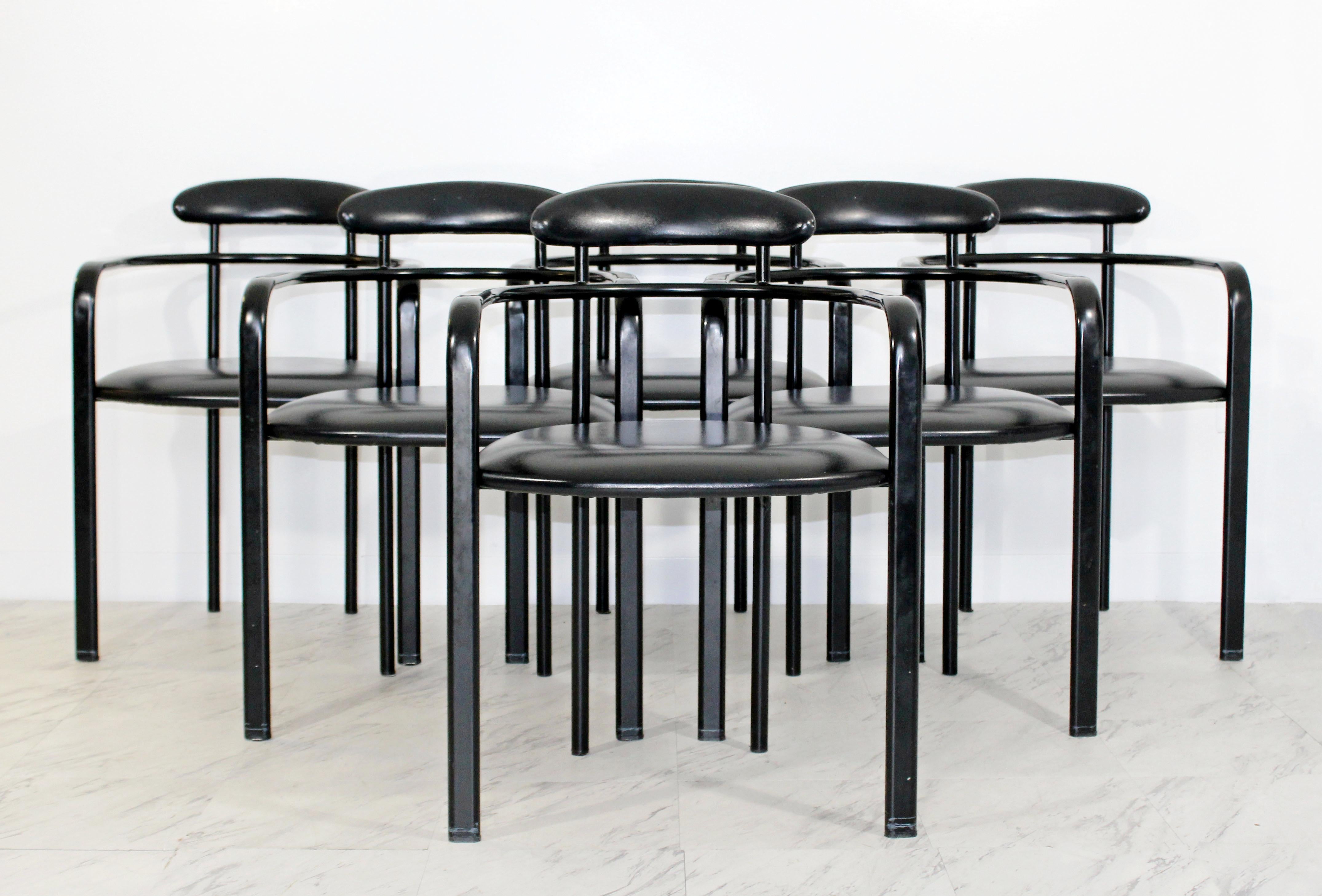 For your consideration is a magnificent, set of six Memphis curved dining armchairs, with black leather seats and backs, by Loewensteins, circa the 1970s. In excellent condition. The dimensions are 22.5