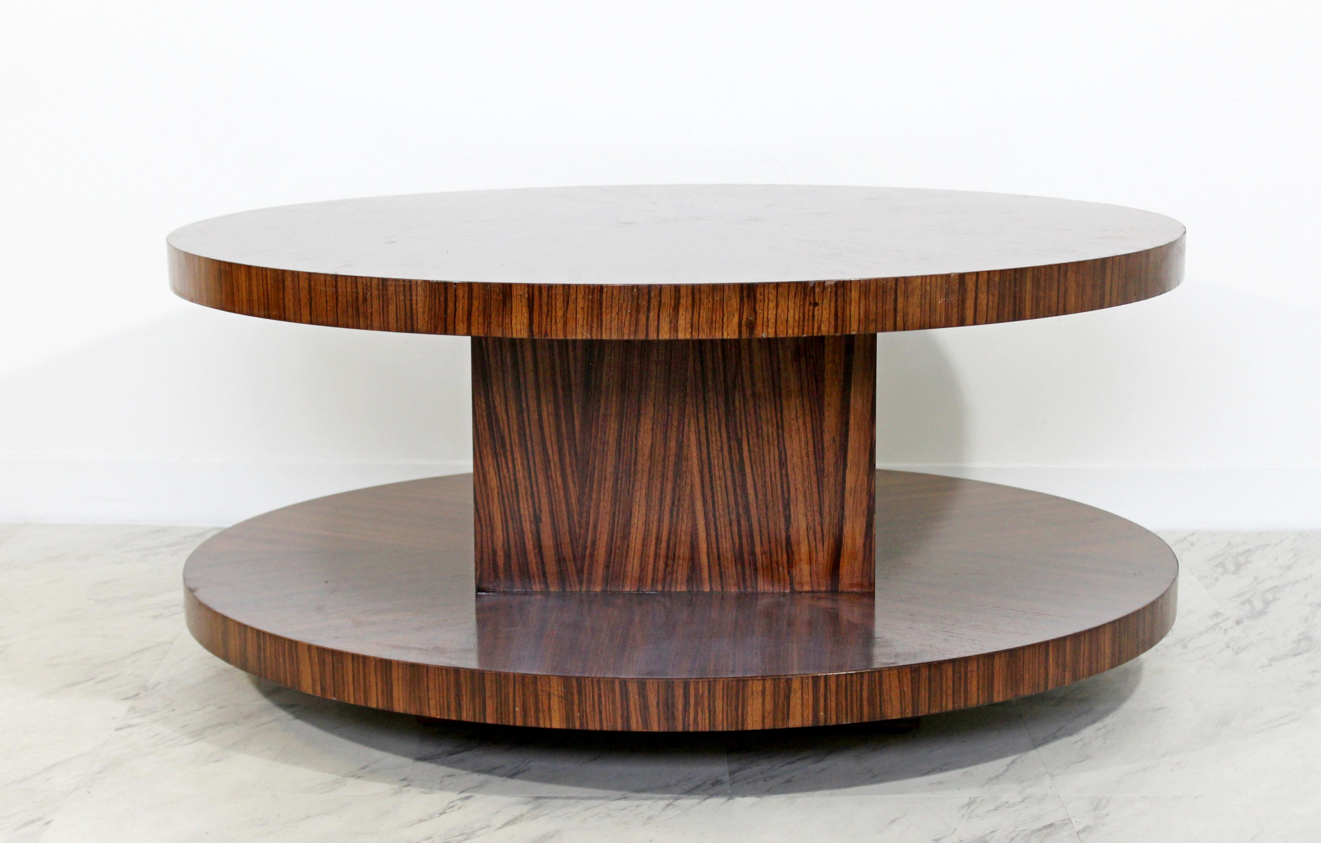 For your consideration is a phenomenally functional, round coffee table, made of zebra wood, and with a swivel top like a Lazy Susan, by Memphis, circa the 1970s. In excellent condition. The dimensions are 42
