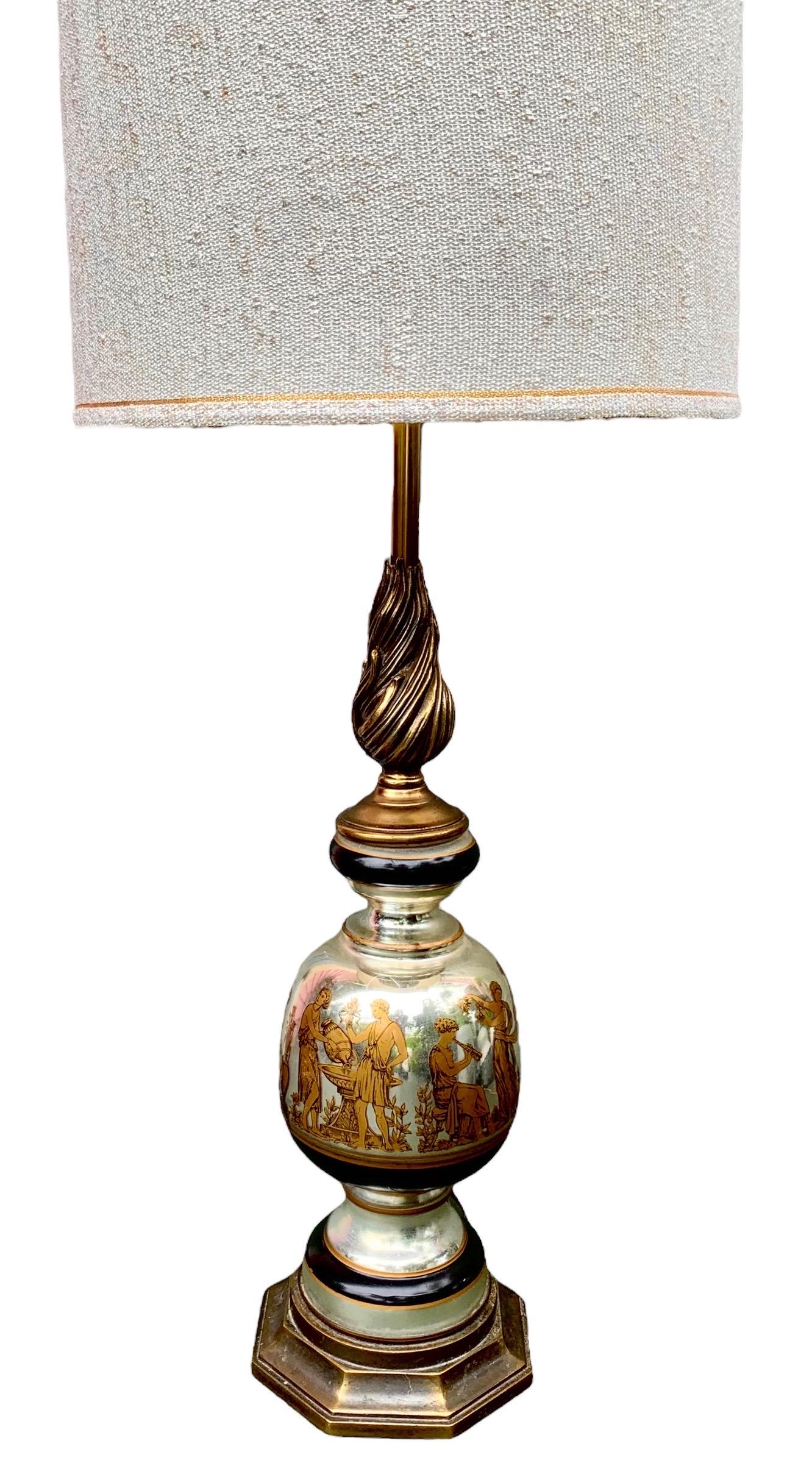 A fine example of Mid-Century Modern style in the form of a mercury glass table lamp with classical Grecian figures and a period shade with gold and black trim. 

The height of Mid-Century Modern elegance with the depiction of gold and black
