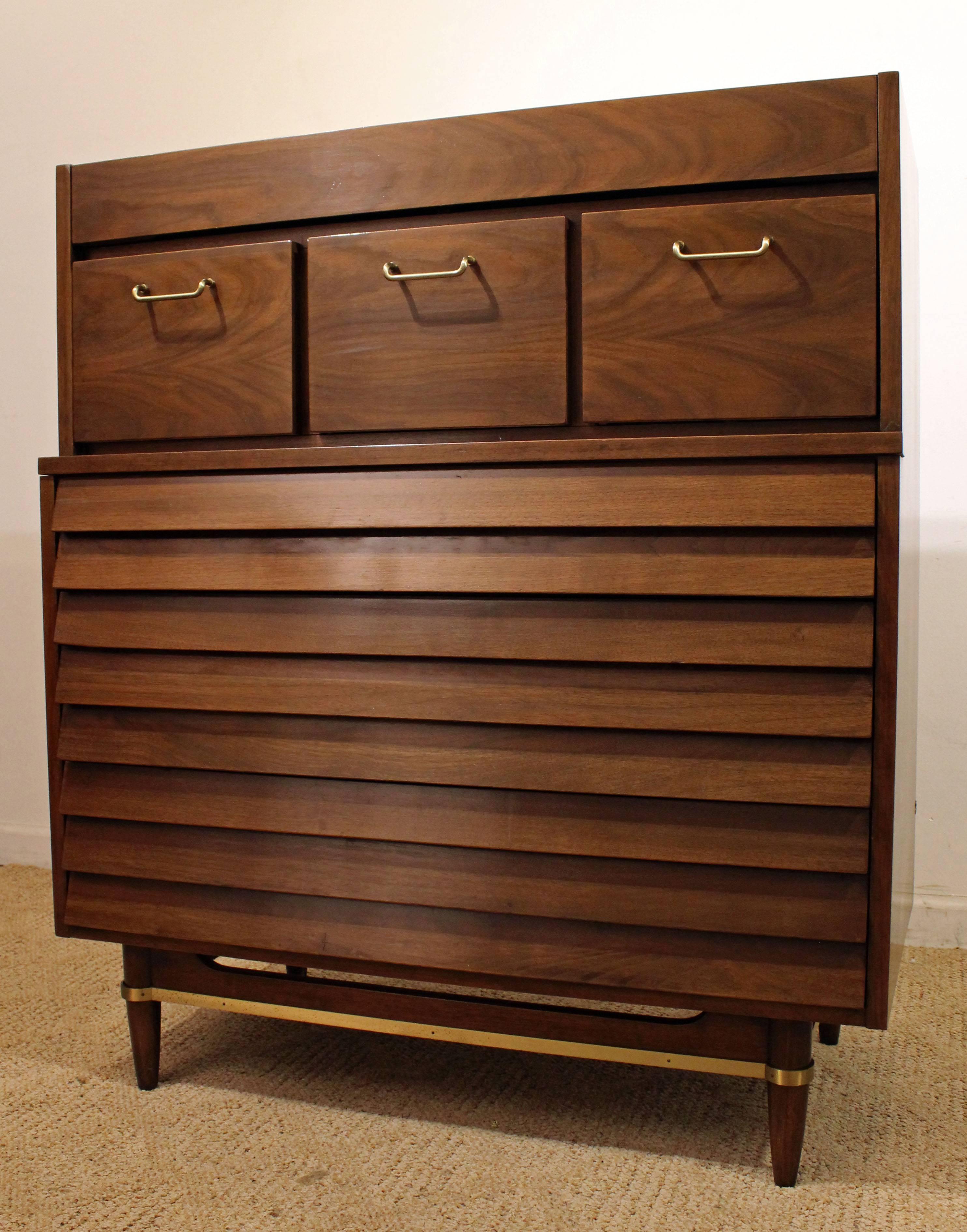 Offered is a Mid-Century Modern tall chest, designed by Merton L. Gershun for American of Martinsville's 