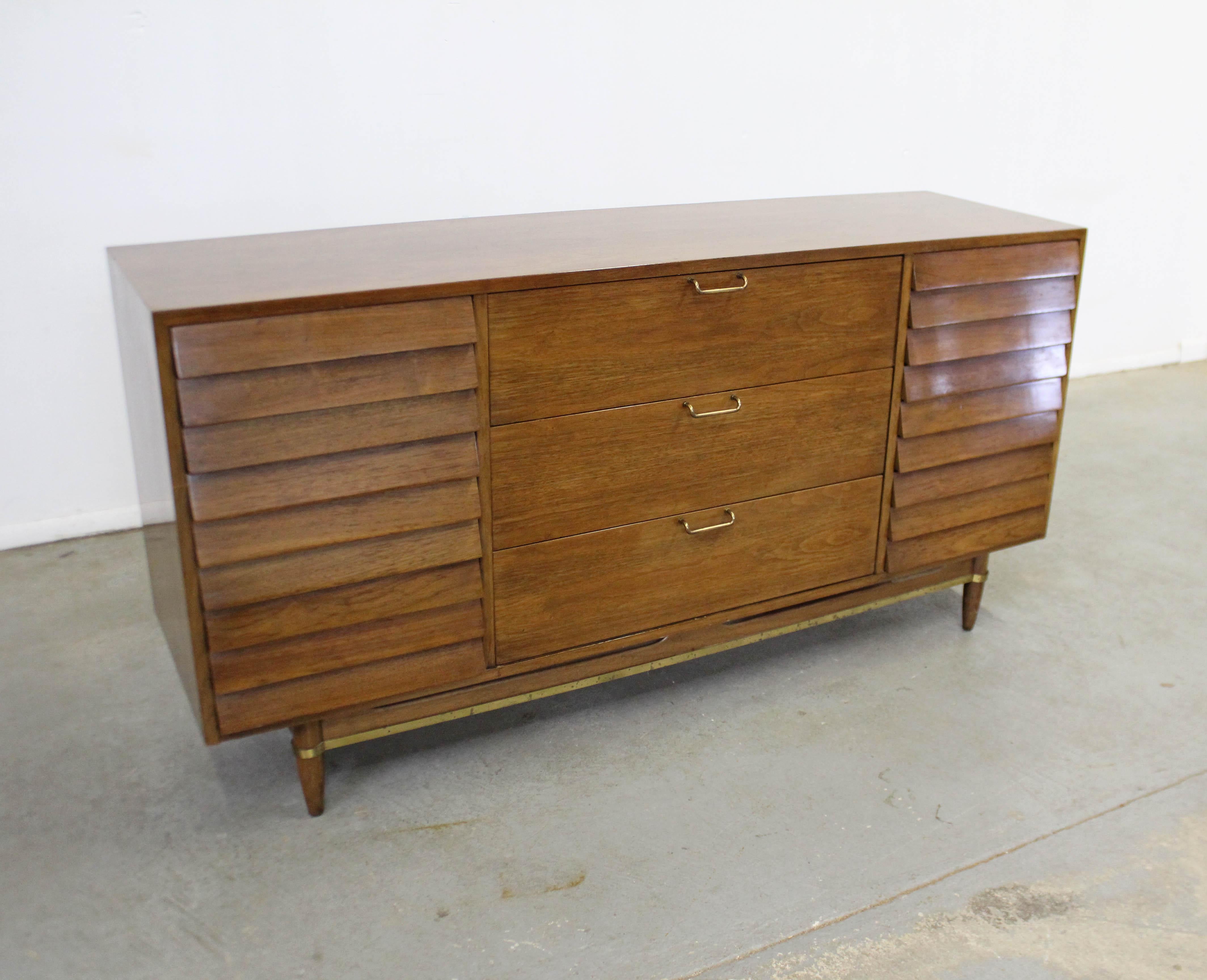 Offered is a Mid-Century Modern credenza, designed by Merton L. Gershun for American of Martinsville's 