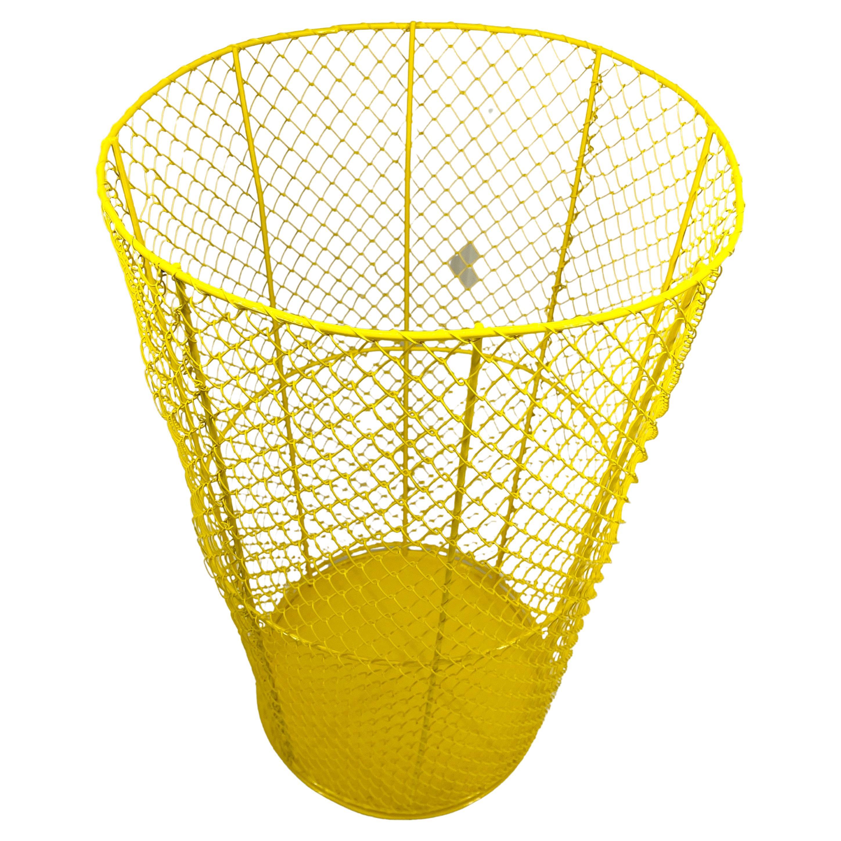 Mid-Century Modern tall metal trash can or hamper. This piece has been freshly powder coated in bright sunshine yellow. Tall and bright, this metal vessel is as attractive as it is functional. Perfect as a hamper for clothing or as a large trash