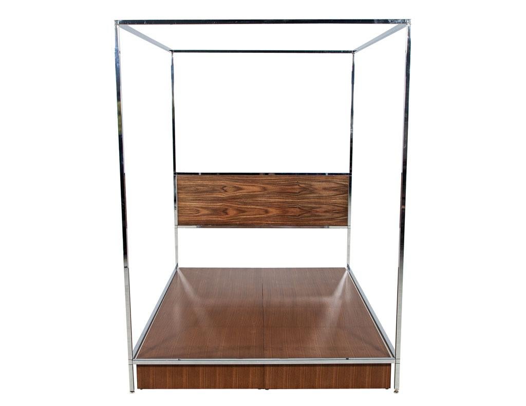 Mid-Century Modern metal queen size bed frame in the style of Milo Baughman. Iconic mid-century modern design, America, Circa 1970’s. Newly refinished walnut woods. Original stainless-steel frame has very minor scratches consistent with age and use.