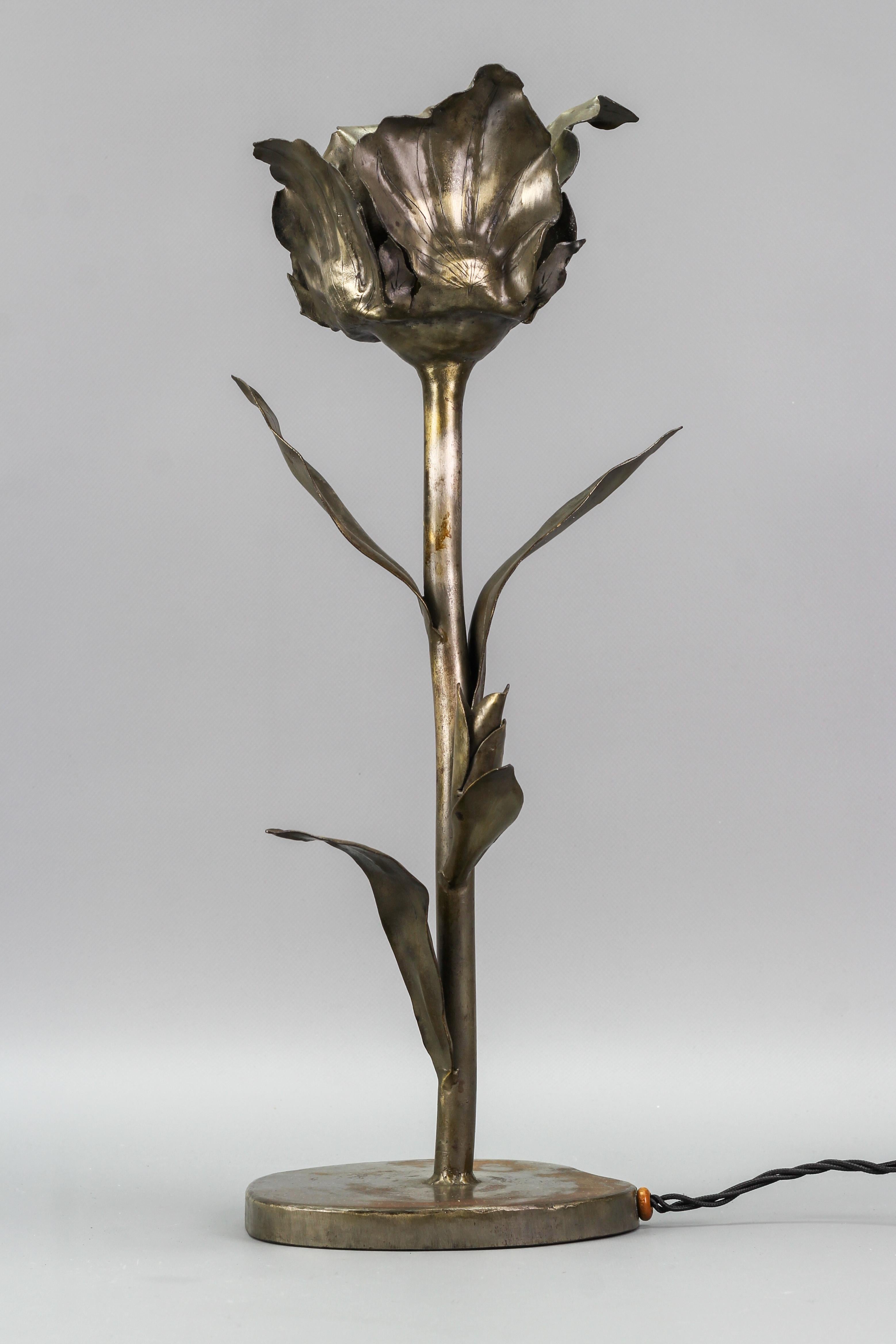 Unique and impressive hand-made Mid-Century Modern metal table lamp in the shape of a large flower with bud and leaves; signed 
