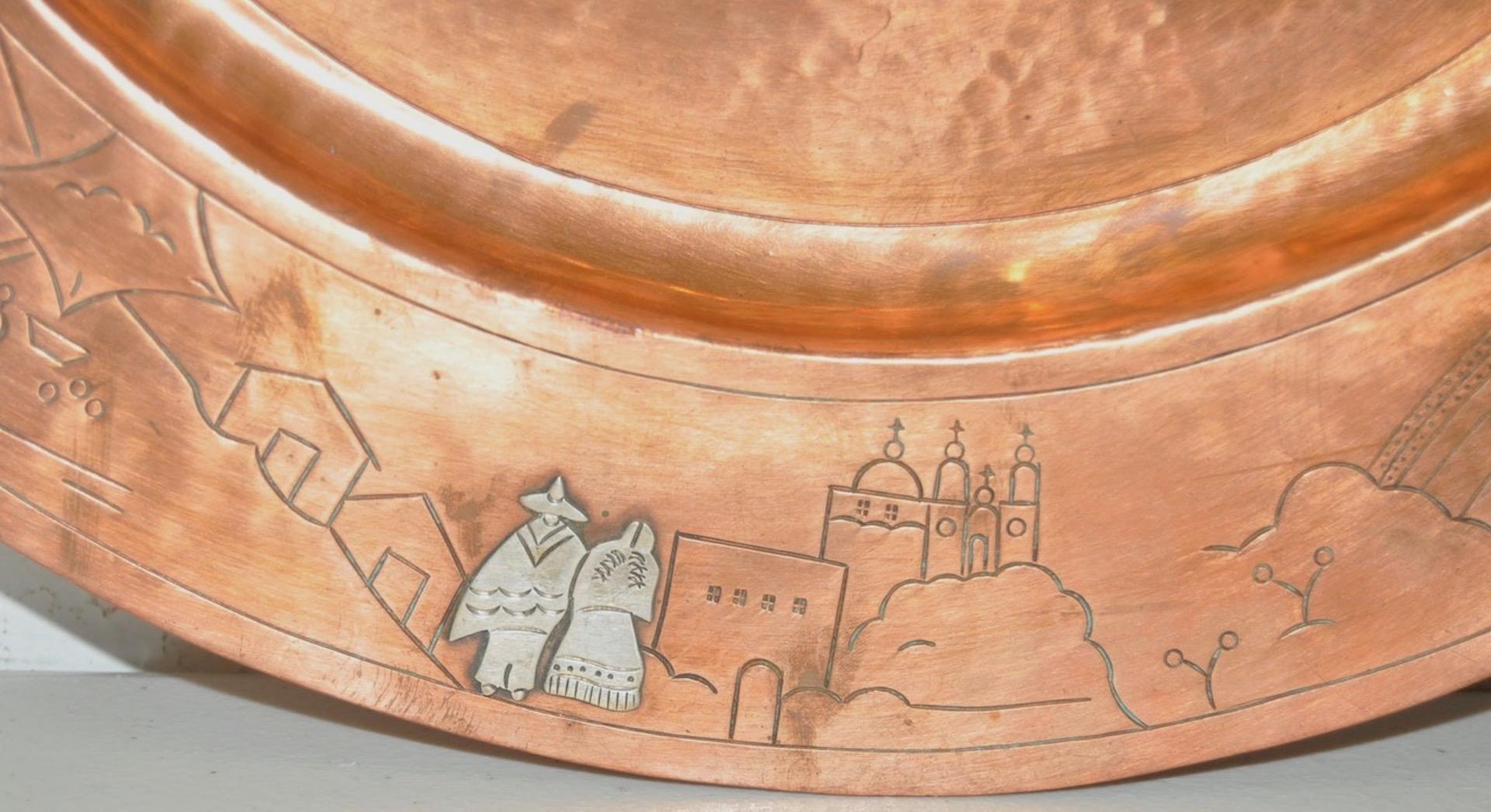 Midcentury copper platter with sterling, circa 1950s

Fantastic copper platter surrounded with sterling donkey, bull fighter, farm worker, and various figures.

The platter is stamped with the hallmarks 