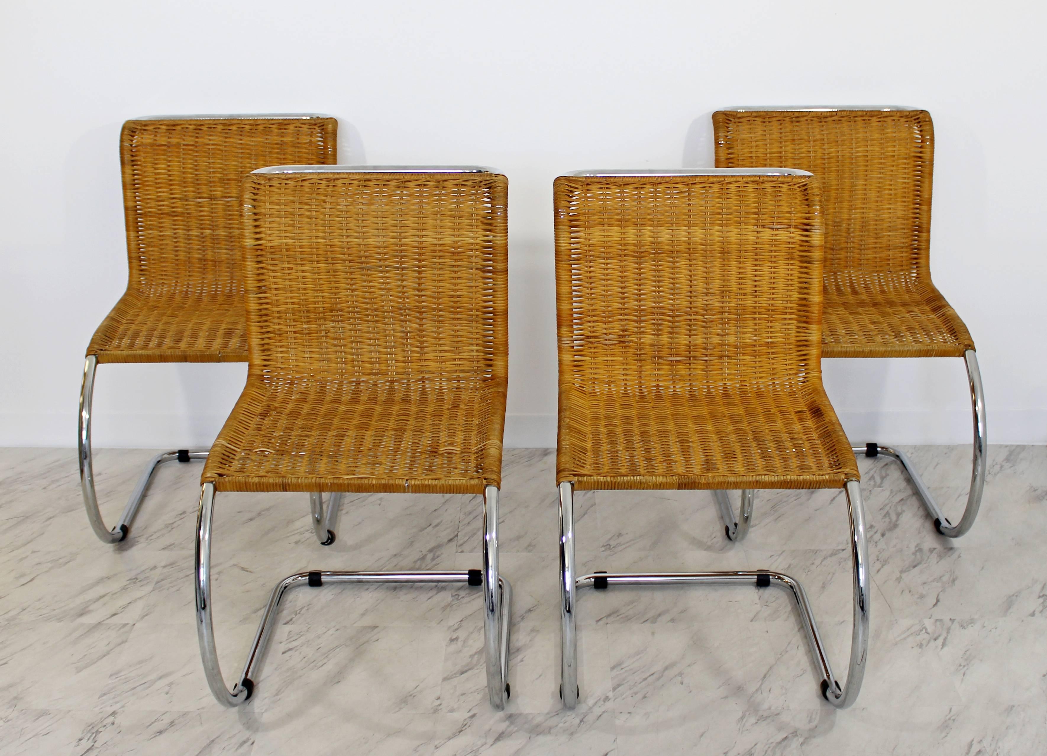 For your consideration is an incredible set of four, cantilever side chairs, made of wicker/cane and chrome mr10, by Ludwig Mies van der Rohe, circa 1970s, made in Italy. In excellent condition. Just came back from being professionally recaned. The