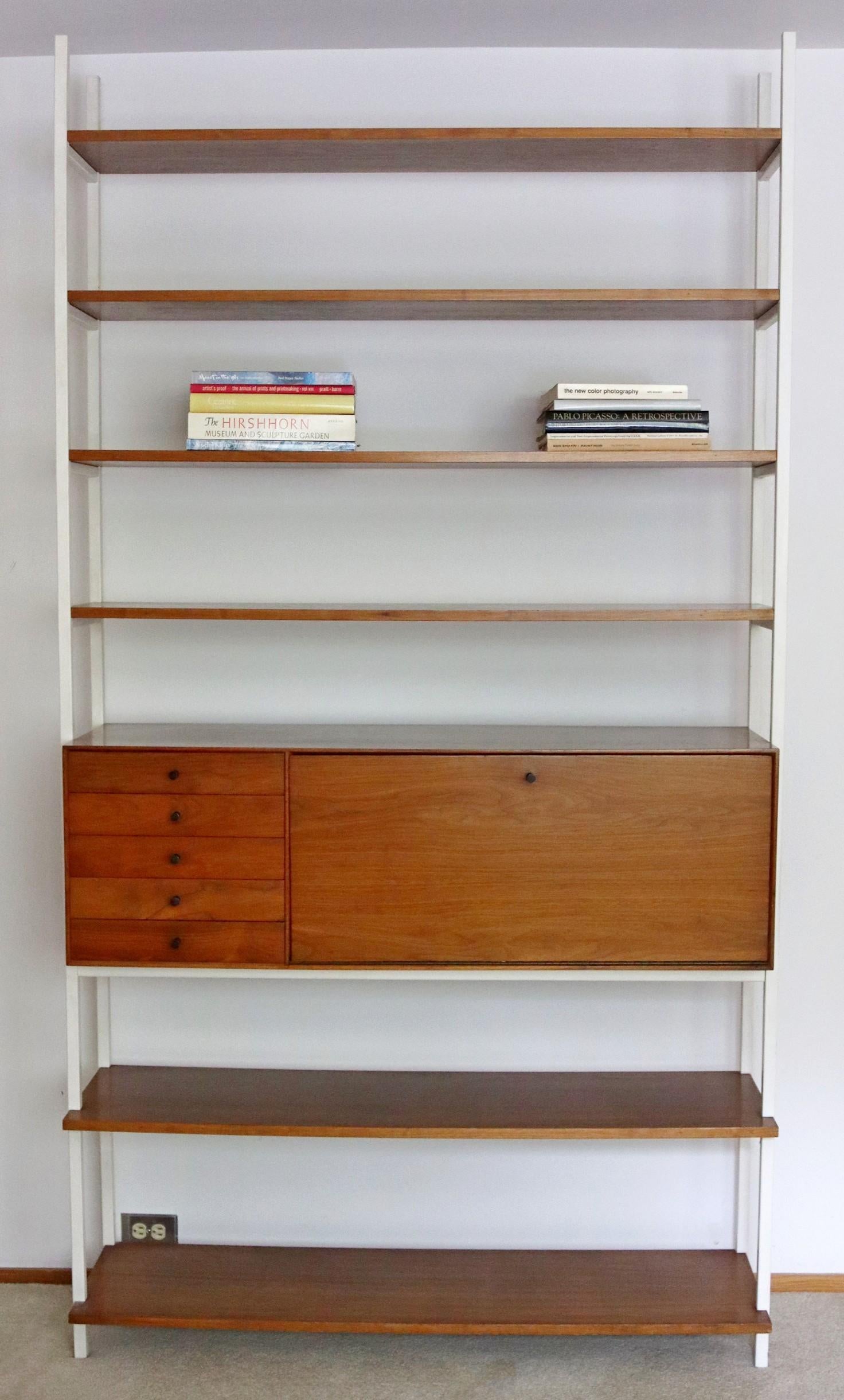 For your consideration is a delightful wall unit, made from walnut and metal shelving, by Milo Baughman for Arch Gordan, circa the 1970s. In excellent vintage condition. Dimensions: 50
