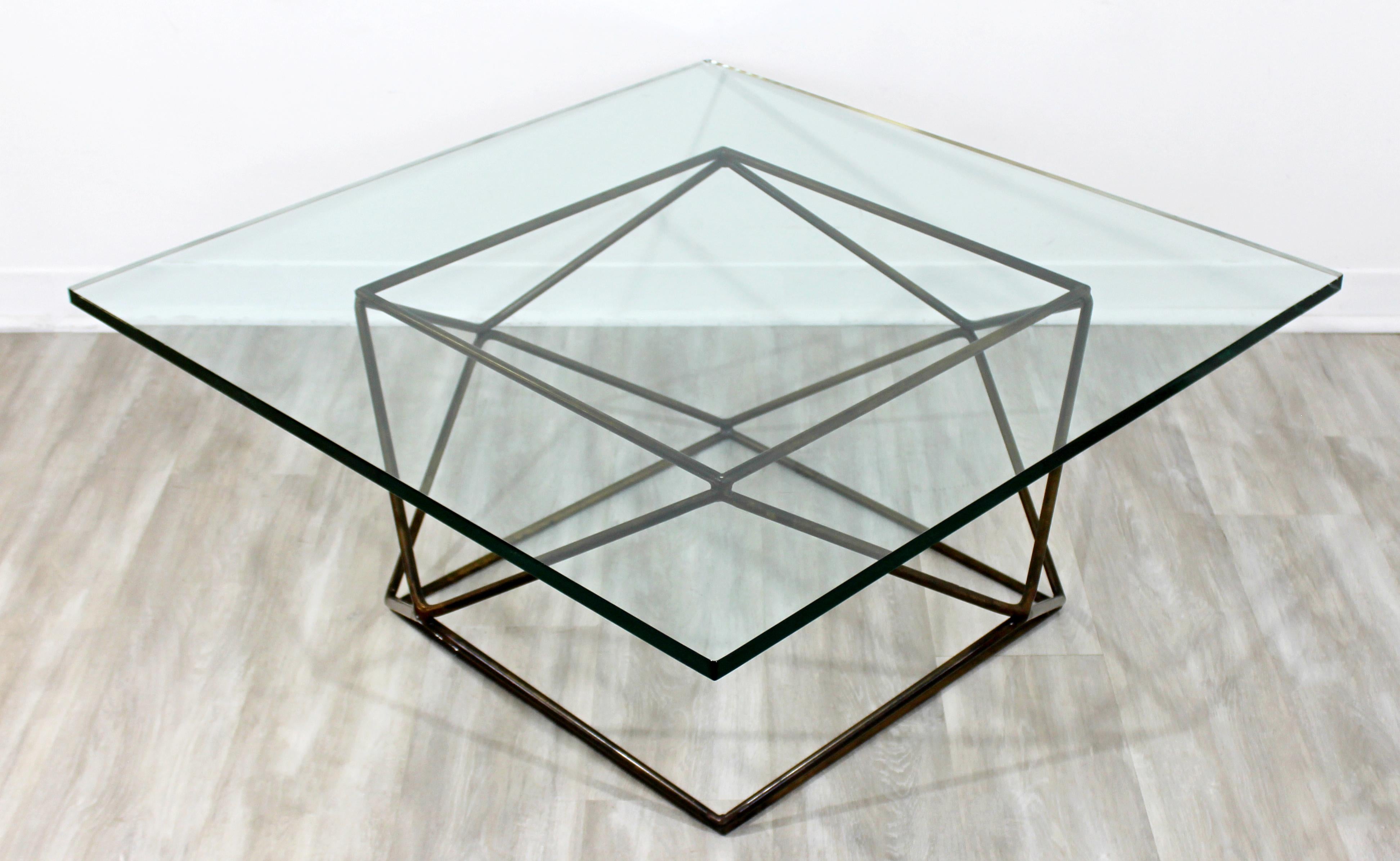 For your consideration is a geodesic, square glass top coffee table, made of bronzed steel, by Milo Baughman, circa 1970s. In excellent condition. The dimensions are 38