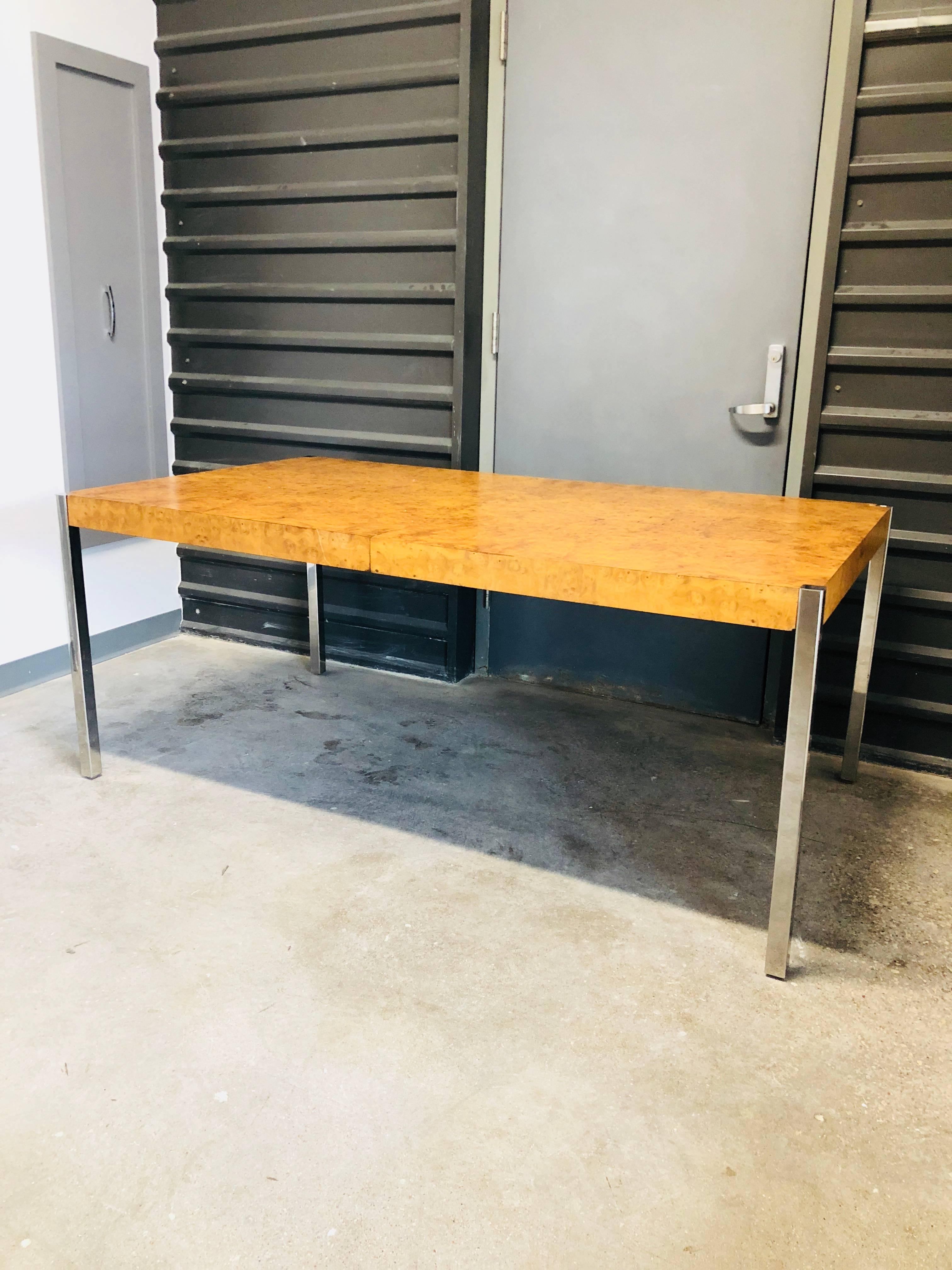 Offered is a Mid-Century Modern Milo Baughman style burl wood and chrome dining table or writing table or desk. This Classic table would look fabulous with any decor. The table can be extended, however, the leaves were not available with the table