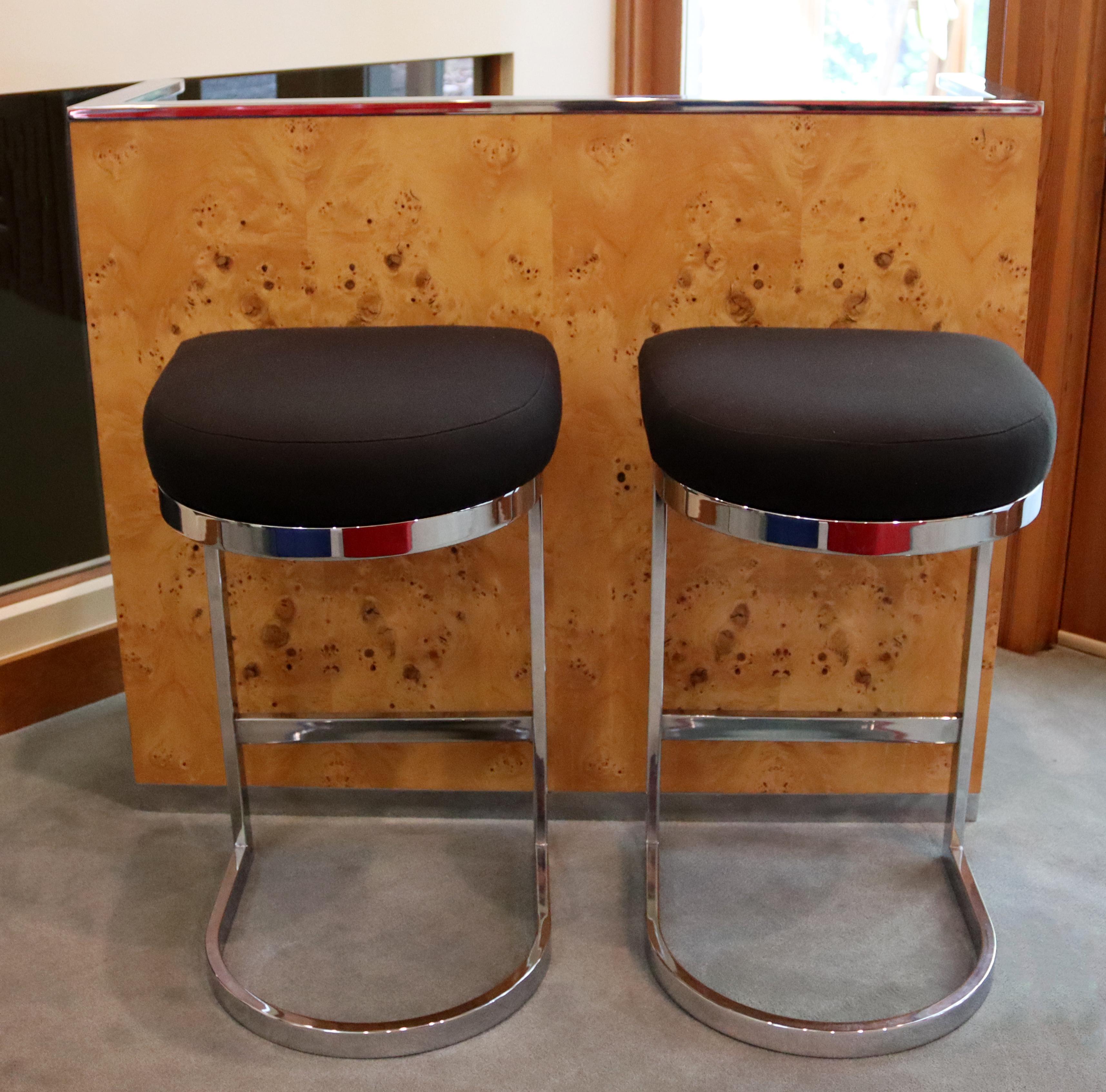 For your consideration is a spectacular, burlwood standing bar, with chrome accents and a pair of cantilever chrome barstools, by Milo Baughman, circa the 1970s. In excellent vintage condition. The dimensions of the bar are 48