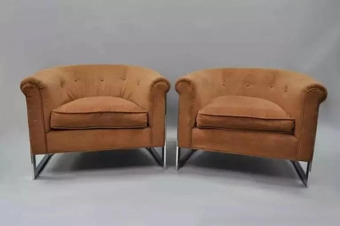 Pair of Mid Century Modern Milo Baughman attributed Chrome Barrel Back Club Lounge Chairs. Item features low sleek forms, chrome frames with chrome support down the rear, rolled backs, and clean modernist lines. Circa Mid 20th Century. Measurements: