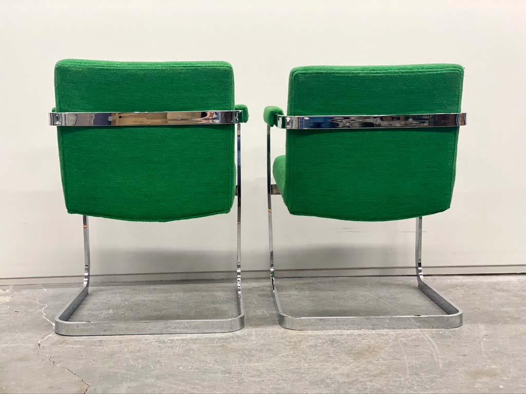 This beautiful pair of Mid-Century Modern Milo Baughman side chairs are in wonderful condition and can be used with existing upholstery. The flat bar chrome frame is heavy and weighted properly for comfort and support. The color is a wonderful green