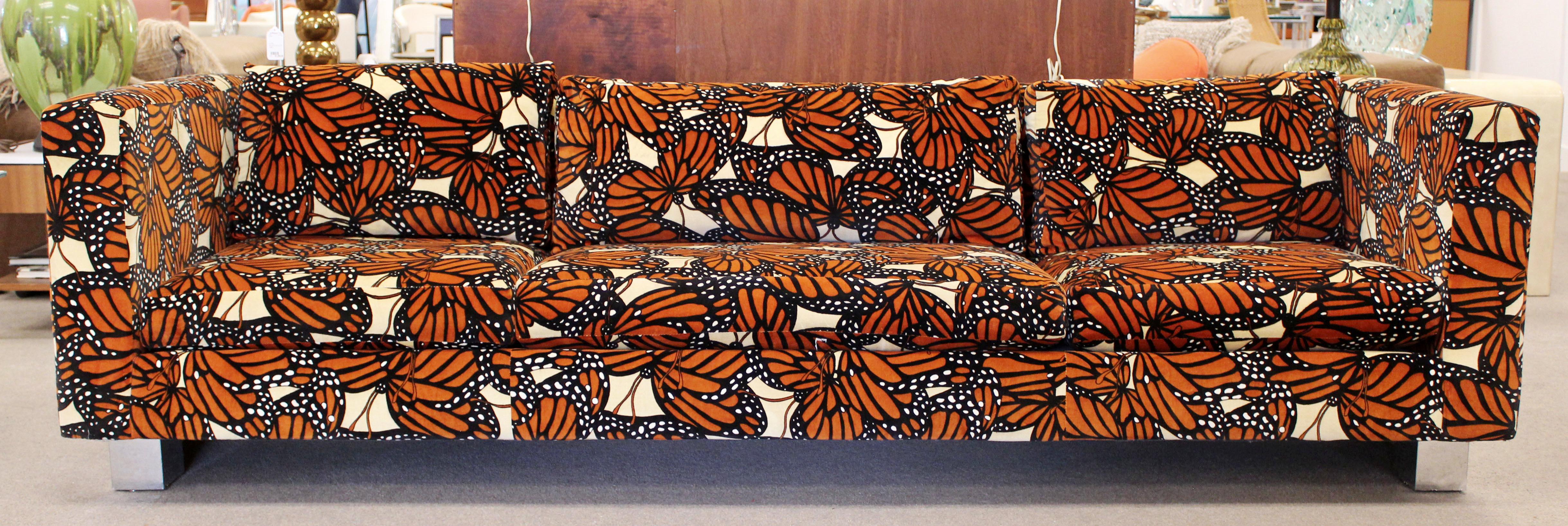 For your consideration is an incredible sofa with chrome accents, by Milo Baughman, with a rare Jack Lenor Larsen monarch butterfly fabric, circa 1970s. In excellent condition. The dimensions are 96