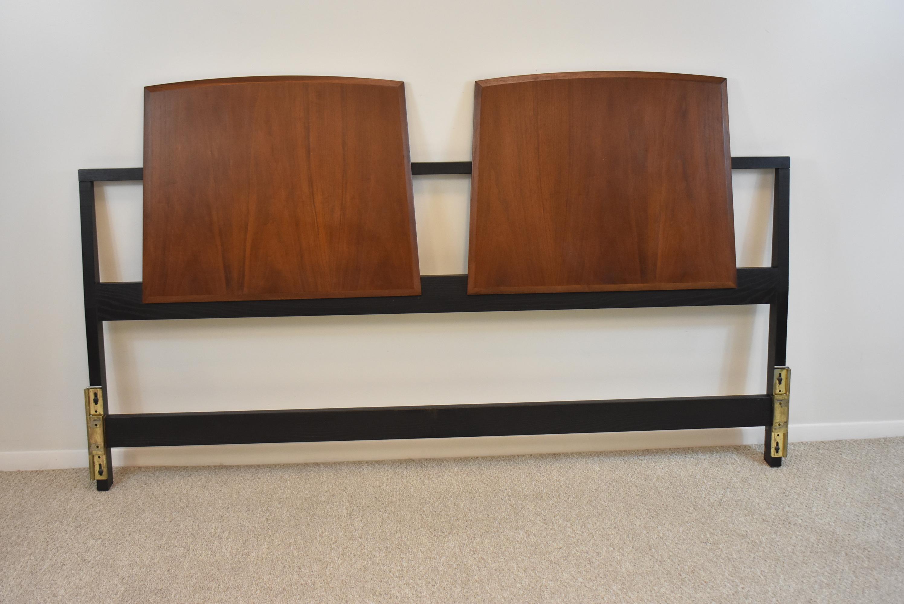 Mid Century Modern walnut and ebonized wood king size headboard by Milo Baughman. Fitted brackets for a steel bed frame. Very nice condition. Dimensions: 3