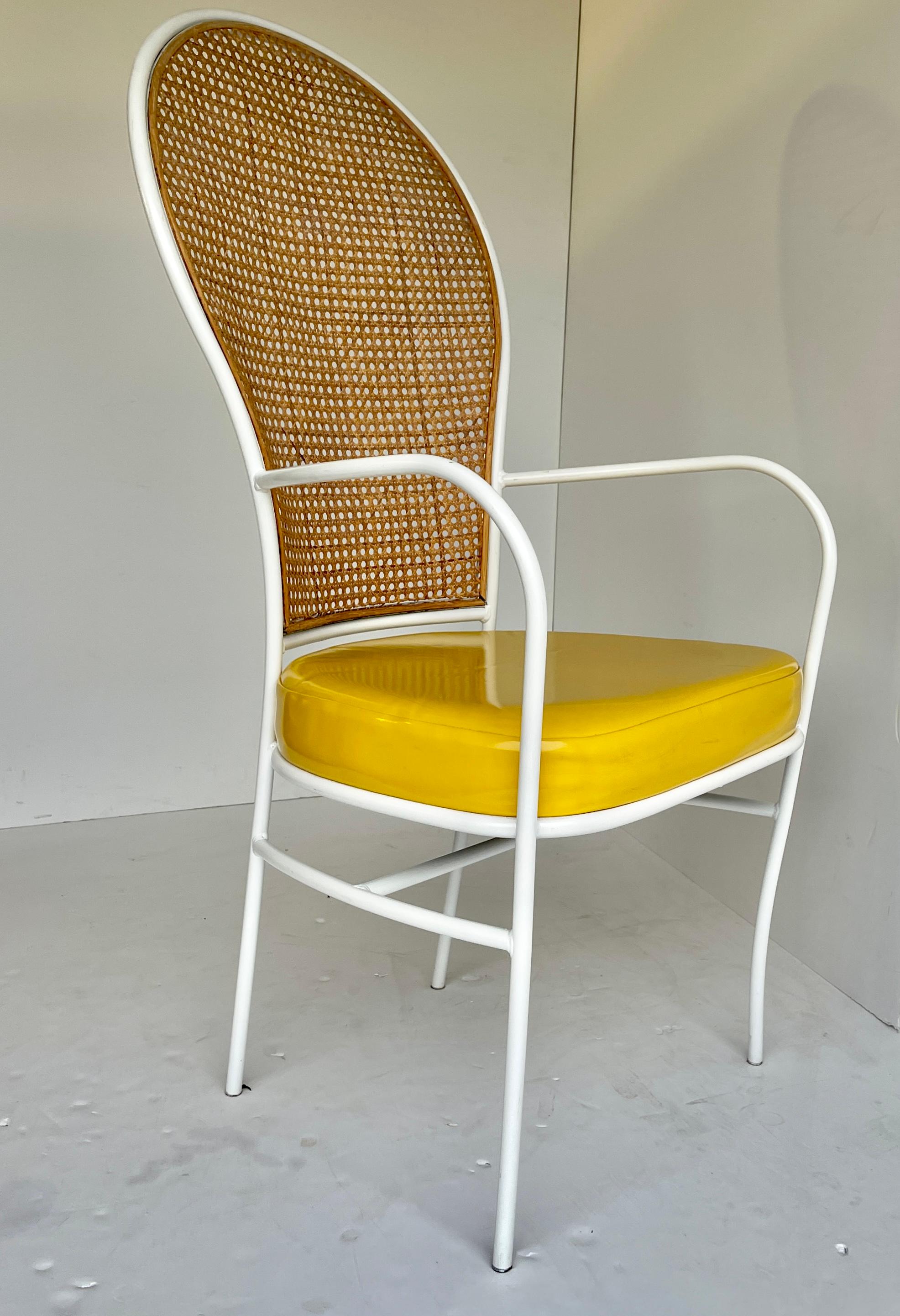 Fabulous and rather rare Milo Baughman for Thayer Coggin Dated 1976. Wrought iron white metal with cane back. Upholstered seat in original bright yellow vinyl. Original makers label and date on bottom. Chair is in original condition. Caning on chair