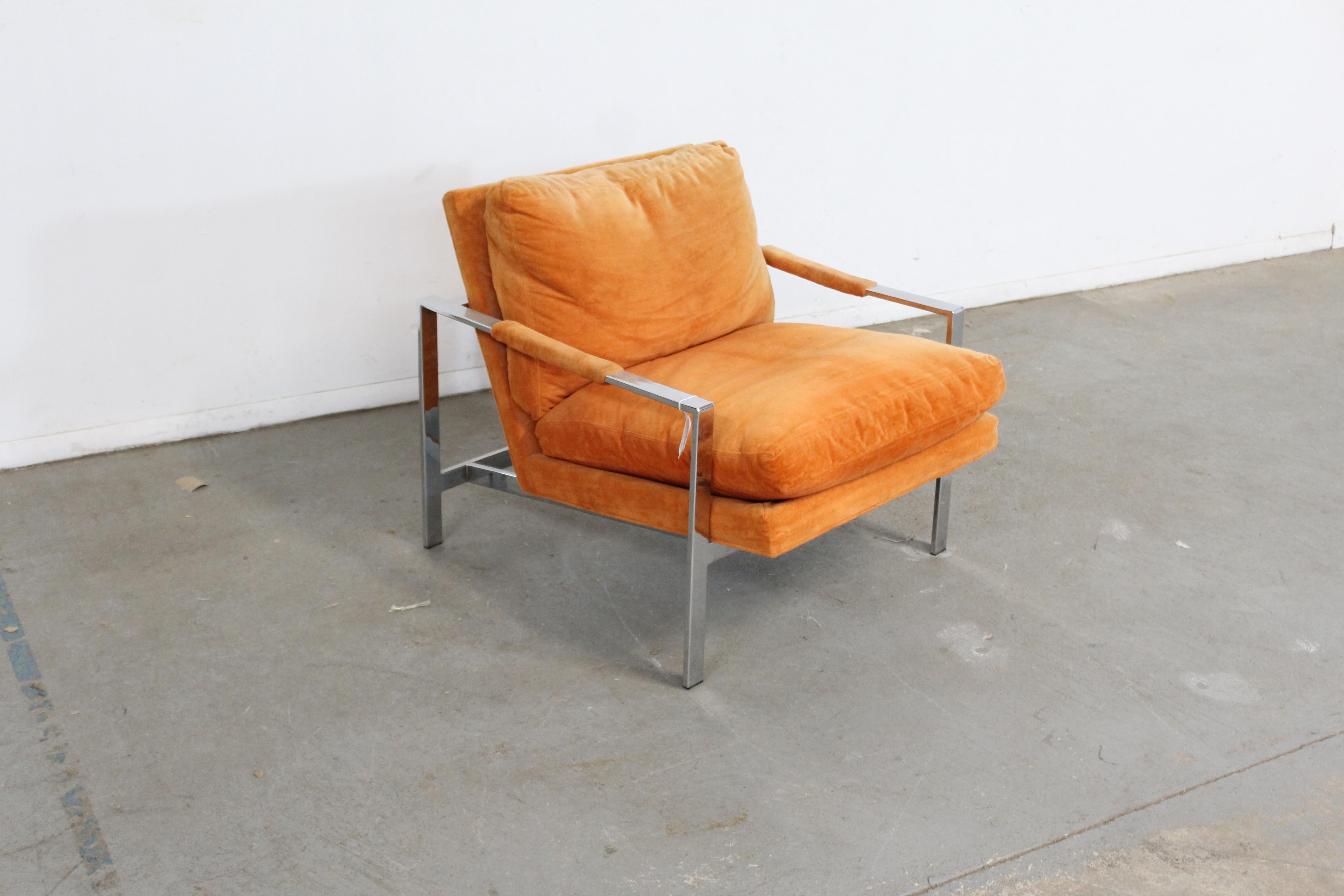 Offered is a vintage Mid-Century Modern lounge chair, designed by Milo Baughman for Thayer Coggin. Timeless clean lines provide the look that has been often copied by others, but never mastered like this. This piece has a chrome base with orange