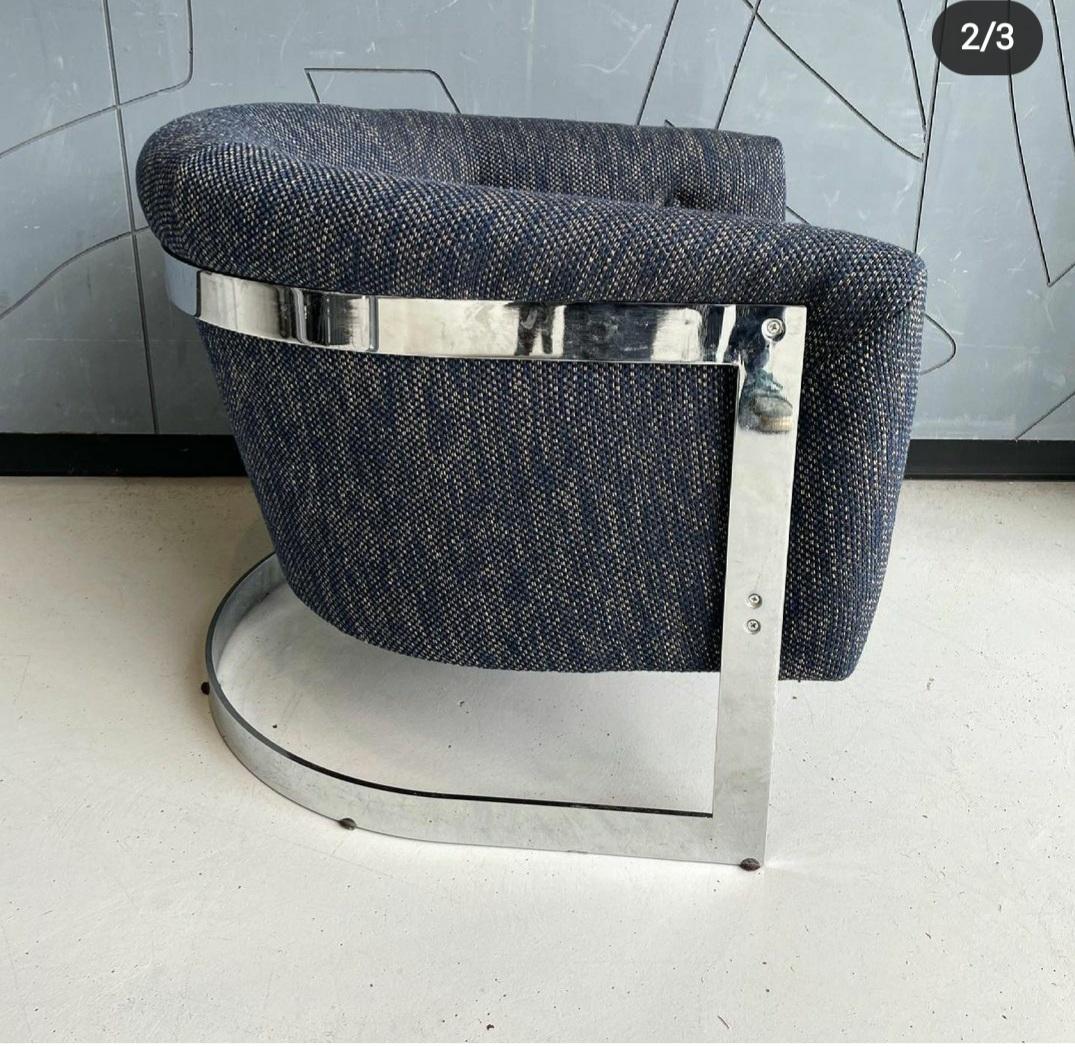 For sale we have a chrome base lounge chair attributeed to Milo Baughman with new navy blue upholstery. The chrome is in very good condition.