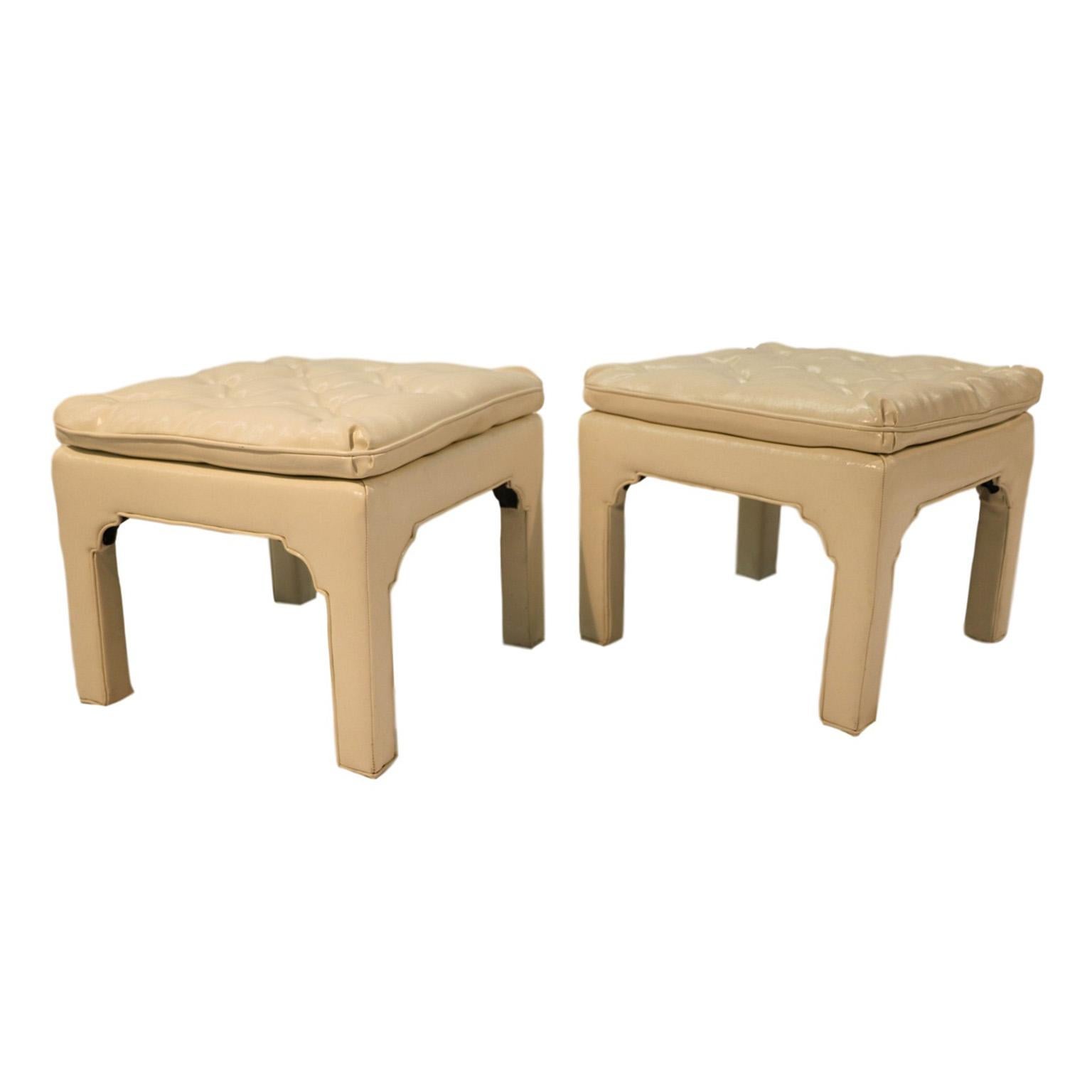 Designed by Coggin, manufactured for Milo Baughman. These elegant pair of fabulous button tufted ottomans, bench or coffee table are upholstered in an off-white vinyl. Uniquely sculpted sides in an open box frame adds a dramatic effect. Stylish and