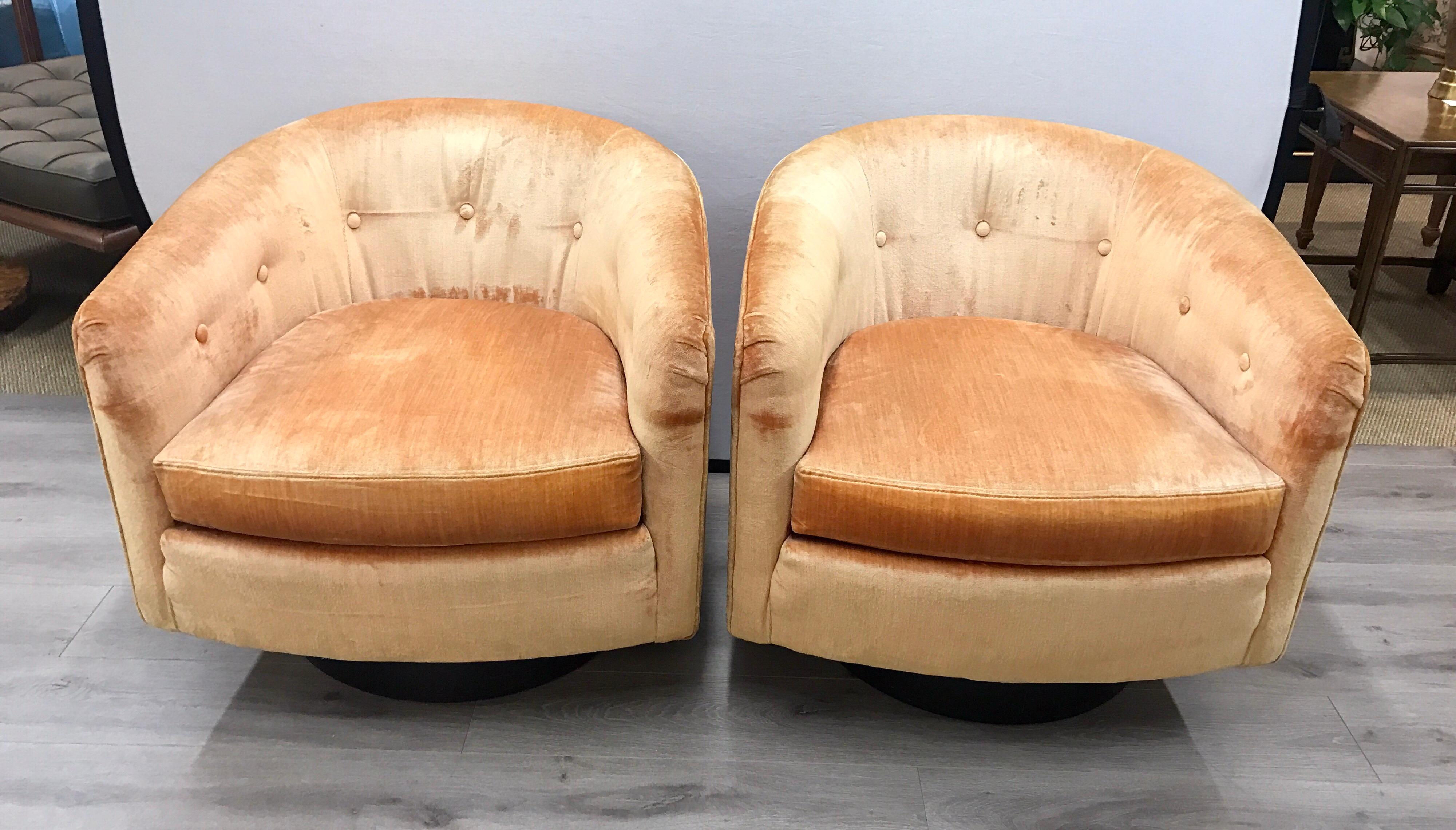 Gorgeous set of midcentury 360 degree swivel chairs with peach colored velvet upholstery.
