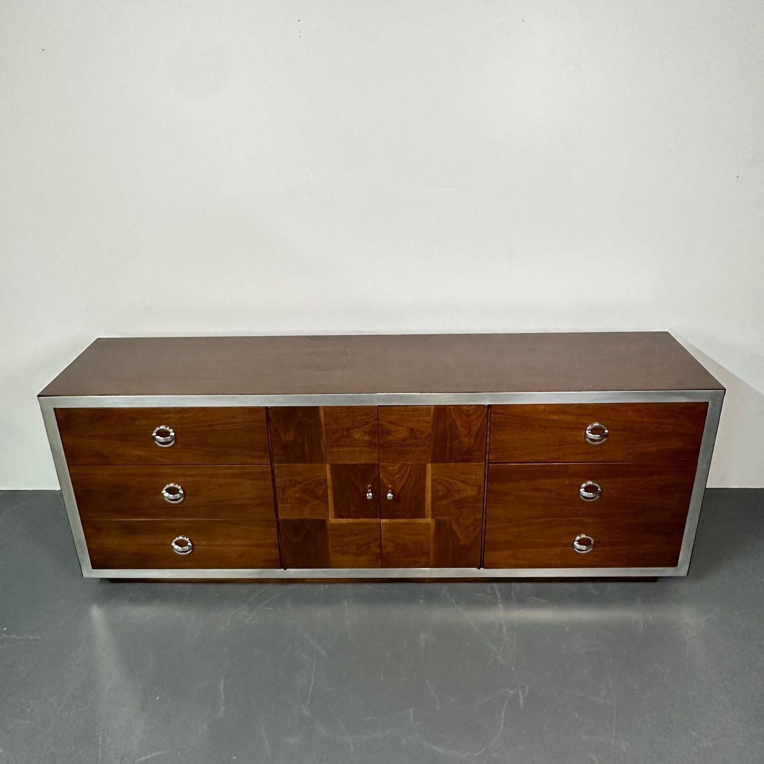 Mid-Century Modern Milo Baughman Sideboard / Dresser, Burlwood, Chrome
Gorgeous mid-century dresser or sideboard designed and produced in the United States, circa 1980s. This piece is made of burlwood with chrome accents and details. Very decorative