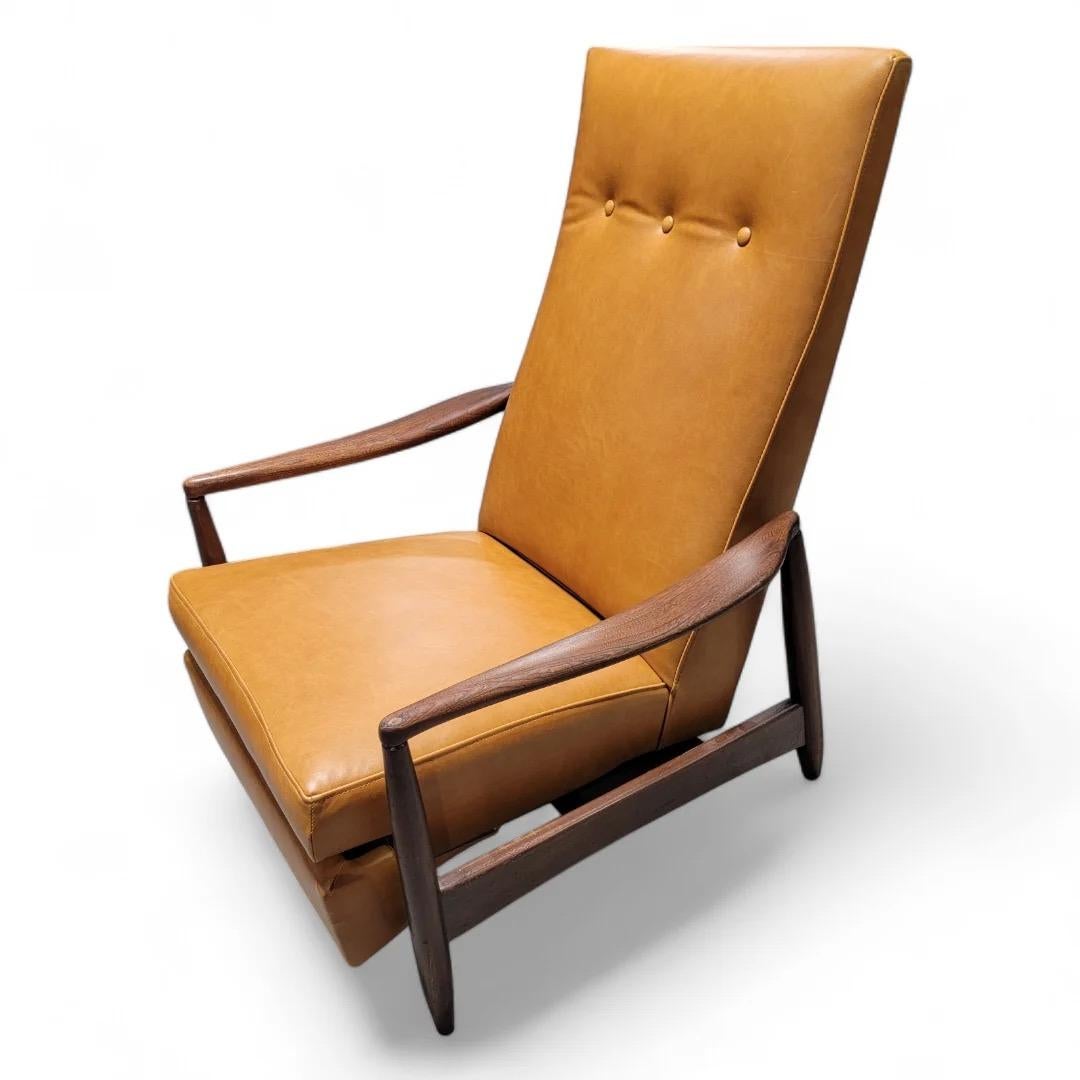 Mid Century Modern Milo Baughman Style Aston Re-Invented Recliner Newly Upholstered in Italian Leather

This amazing mid century modern Milo Baughman Style Recliner would be a perfect addition to any living space! Beautiful walnut frame with a high