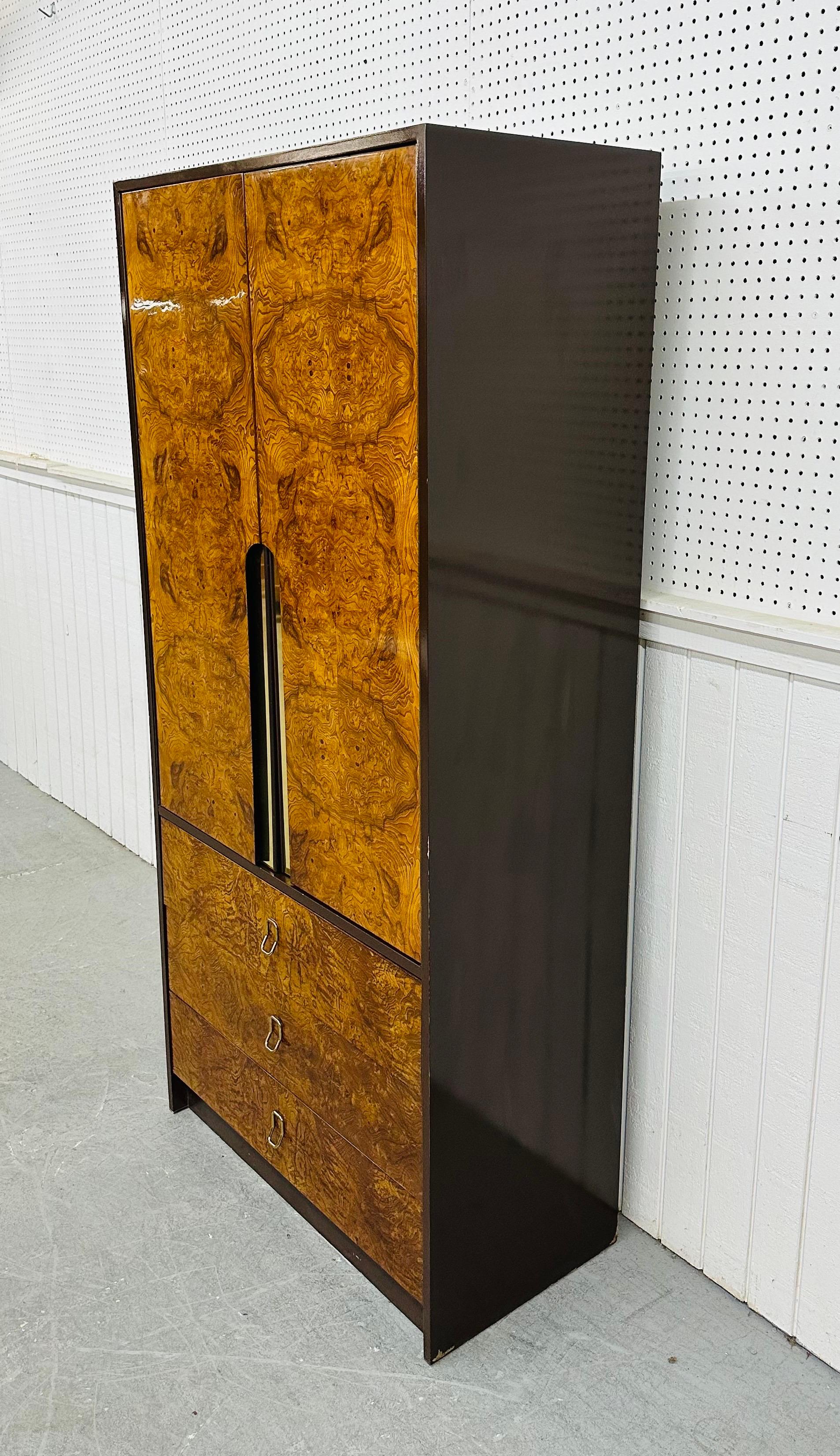 This listing is for a Mid-Century Modern Milo Baughman Style Burled Wood Armoire. Featuring a straight line design, two large doors at the top that open up to interior storage space with four hidden drawers, three drawers at the bottom with brass