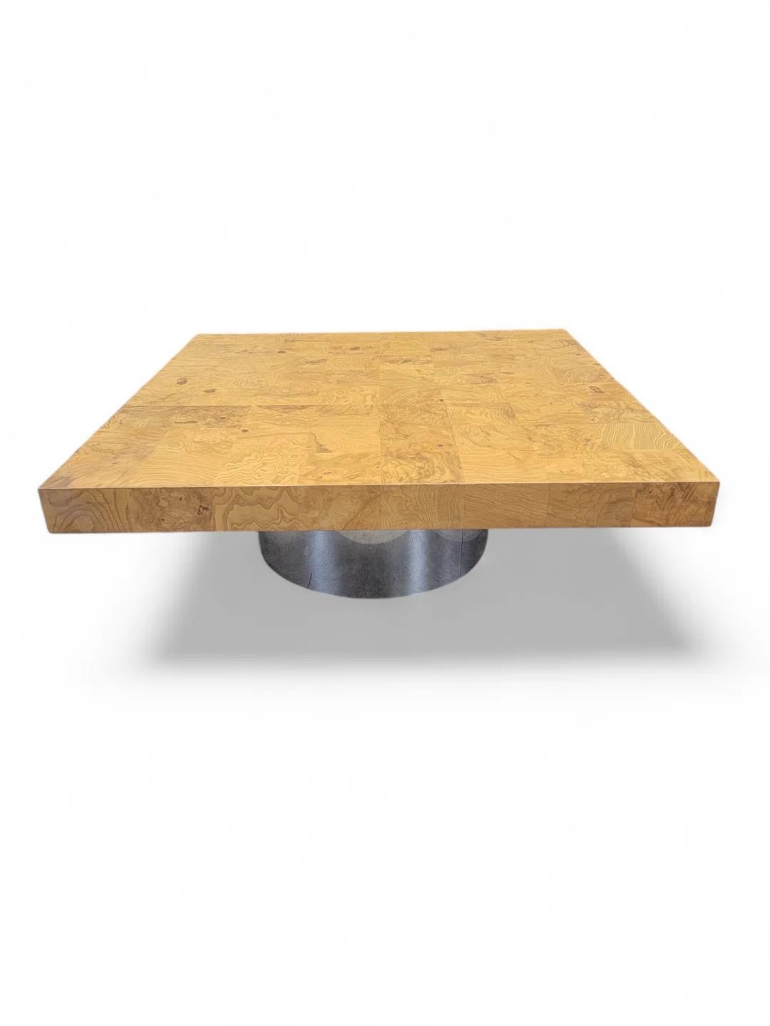 Vintage Mid Century Modern Milo Baughman Style Burlwood Square Top and Chrome Cylinder Base Coffee Table by Pace

Crafted from a chrome pedestal bottom and a burlwood table top, this coffee table would beautifully accent your space. Perfect for a