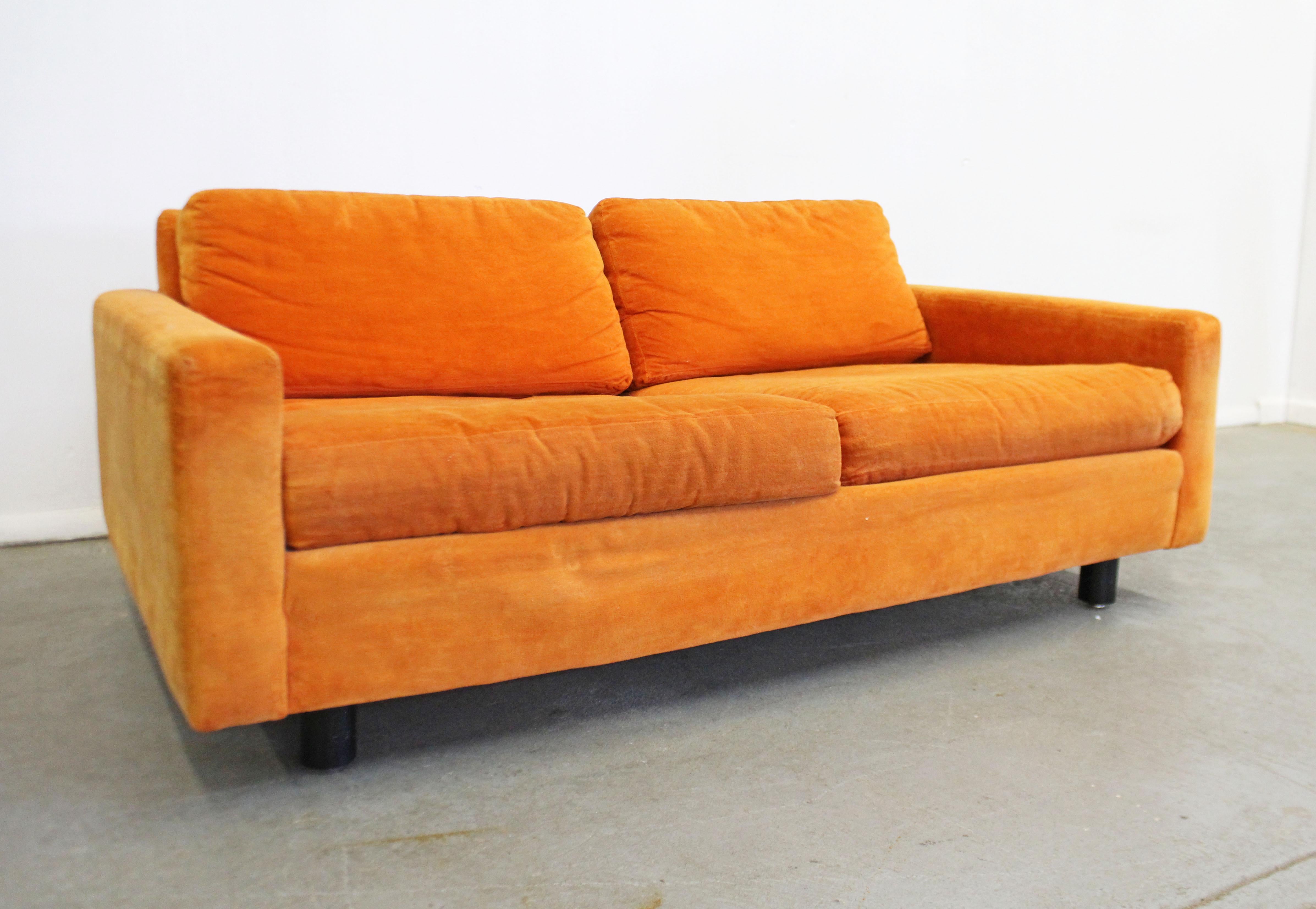 What a find. Offered is a super cool vintage loveseat by Founders 1st Edition. Features original upholstery and wooden legs. It is in overall great condition for its age with some slight age wear on upholstery. It is signed. The sofa has the look of