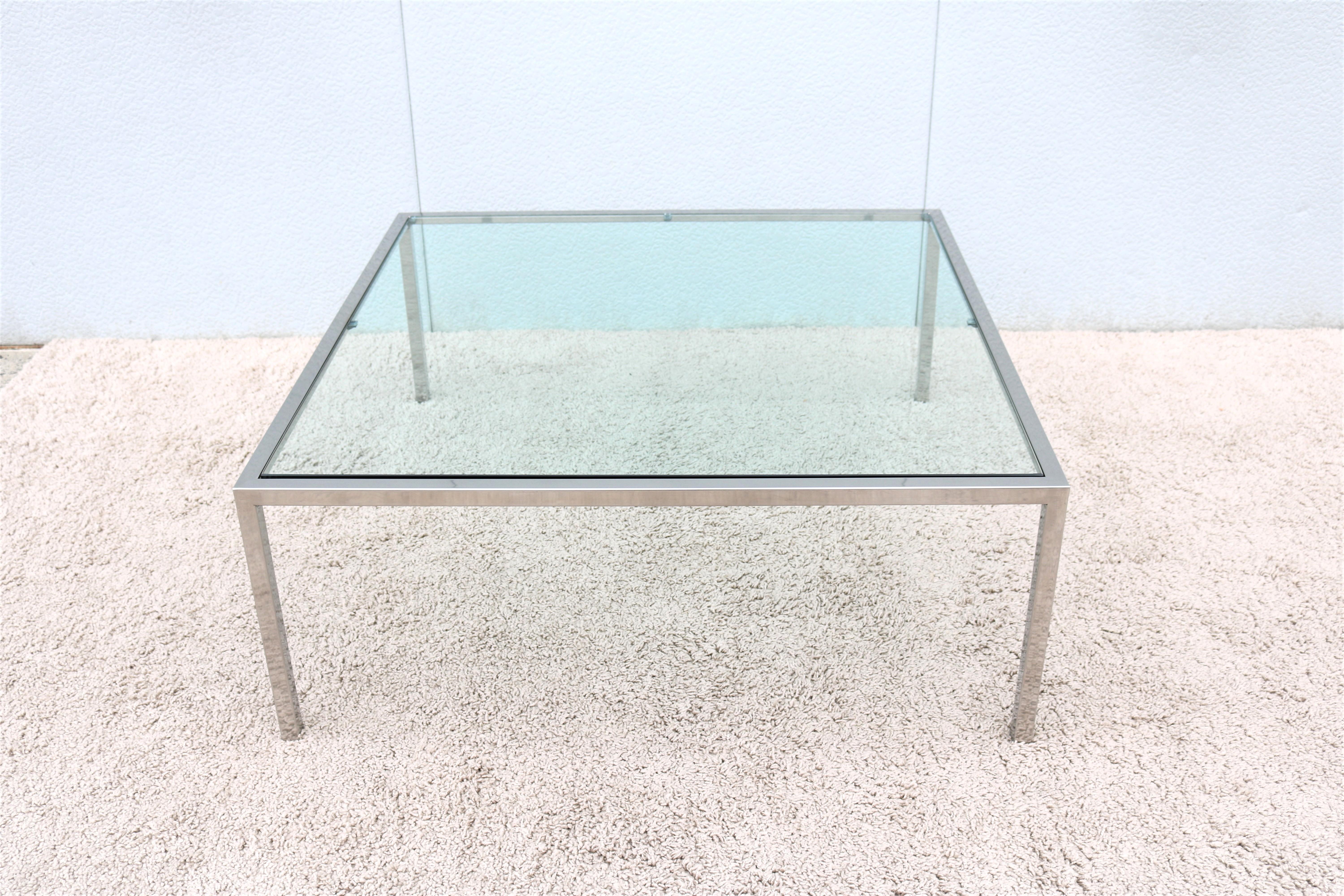 Stunning and elegant looking mid-century modern Milo Baughman style polished stainless steel and inset glass top square coffee table.
Fine quality and beautiful craftsmanship make this table an attractive centerpiece for the living room.
The