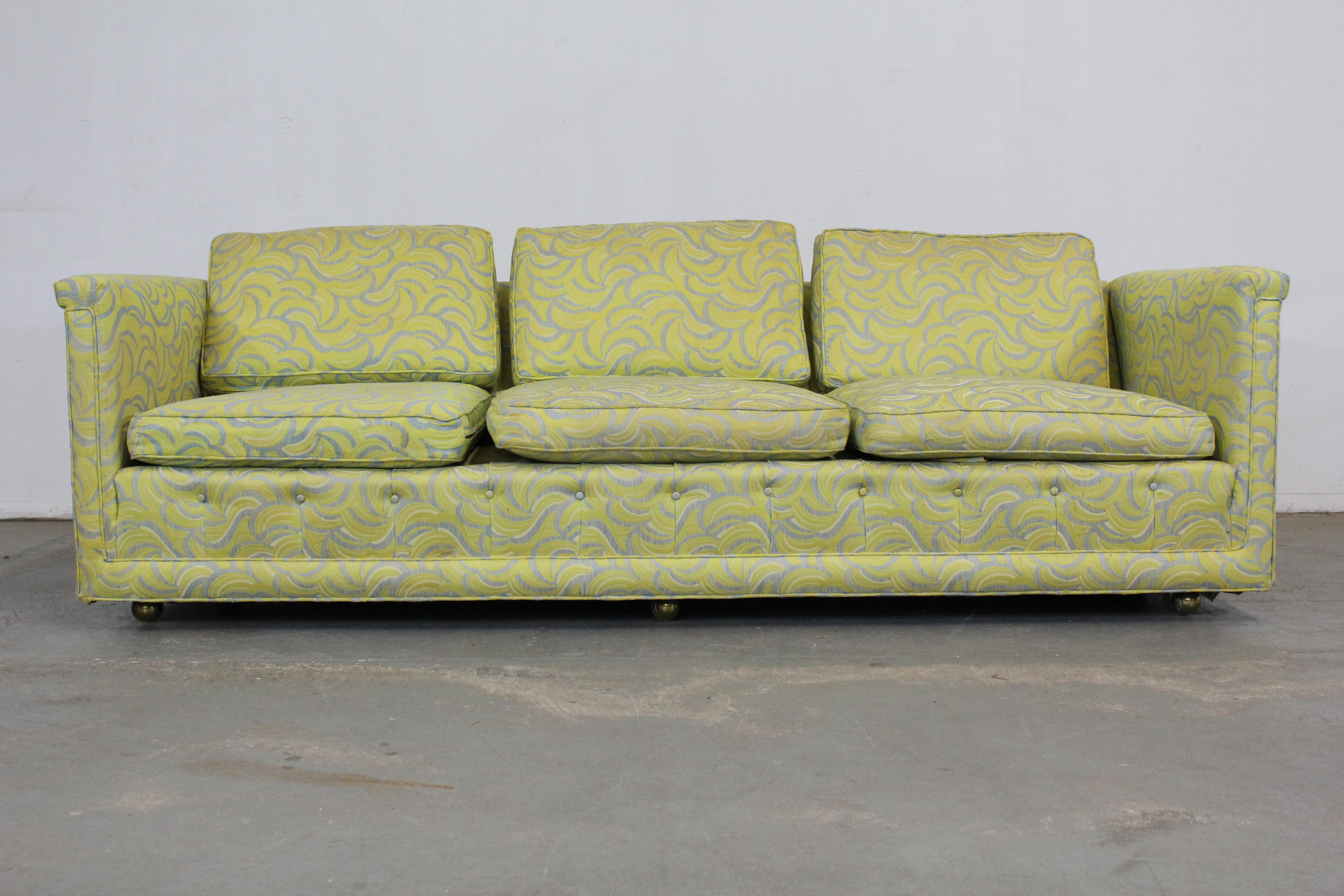 Mid-Century Modern Milo Baughman style sofa

Offered is a Mid-Century Modern sofa. Has three removable cushions and is on castors. It is in great structurally sound condition considering its age with torn upholstery. It is not signed. Will need