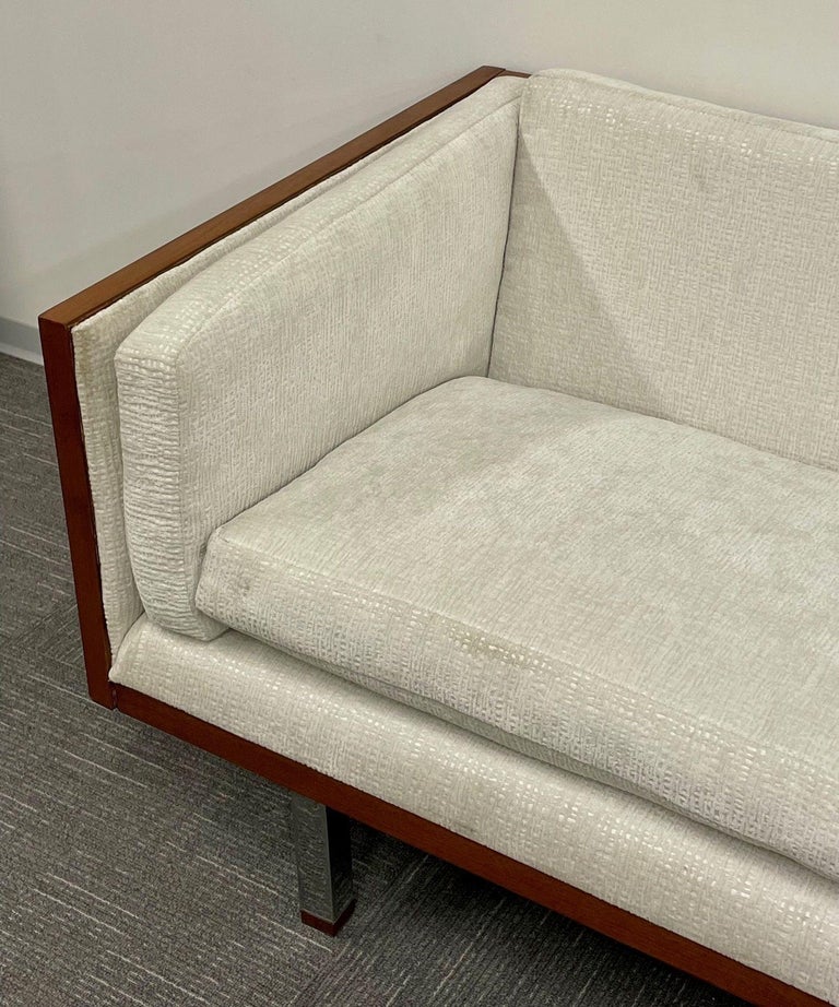 Mid-Century Modern Milo Baughman Style Sofa, Couch, Walnut, Chrome, American in a tweed textile fabric.  Milo Baughman style three-seater sofa having chrome leg supports leading to a walnut wood framed back and sides with fitted cushions on the seat