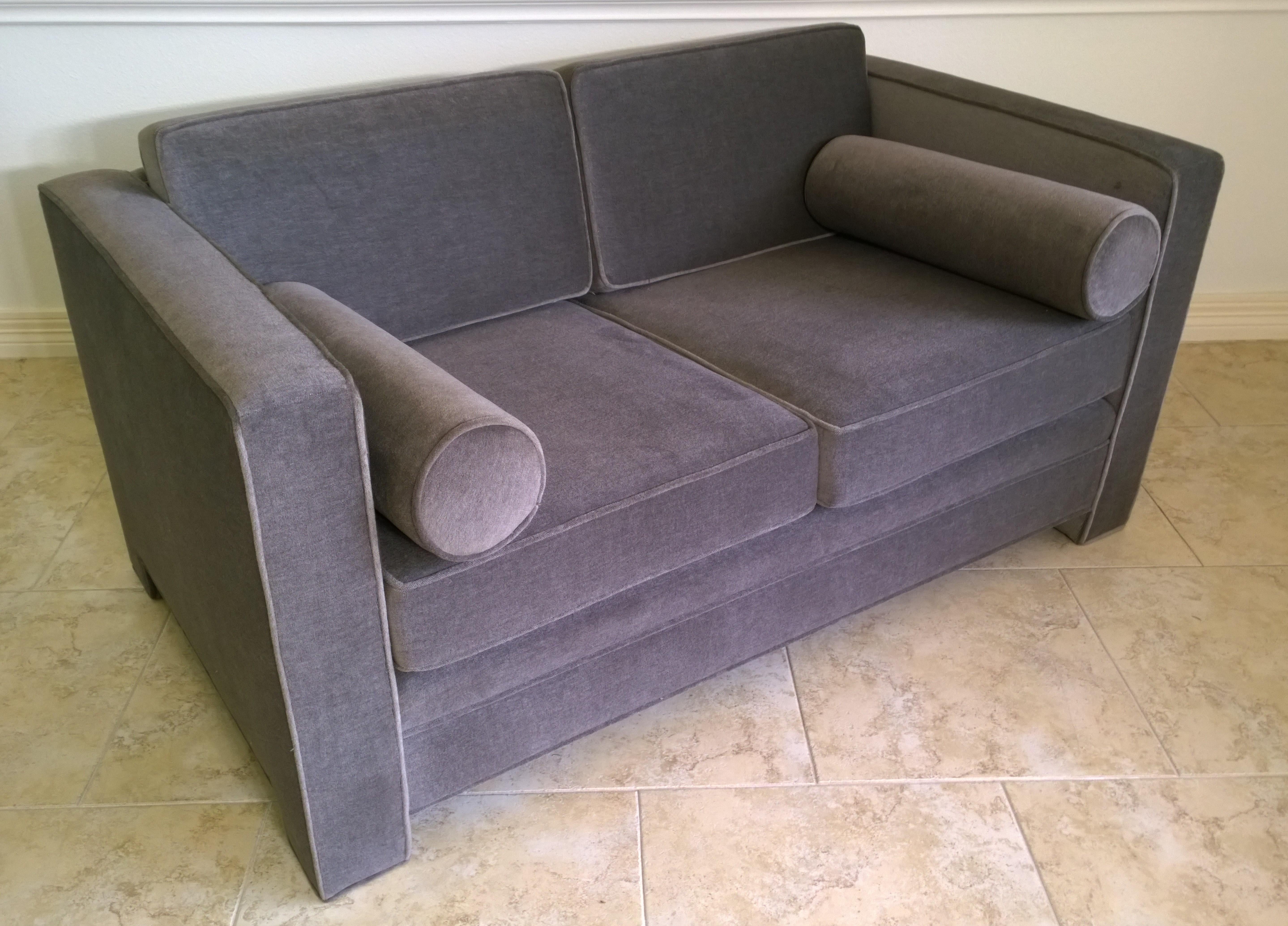 Offered is a Mid-Century Modern Milo Baughman style newly upholstered mohair wool tuxedo love seat in a warm gray / taupe color way. The piece is a two-seat sofa with two-seat cushions and two back cushions and two rolled armrest cushions. The sofa